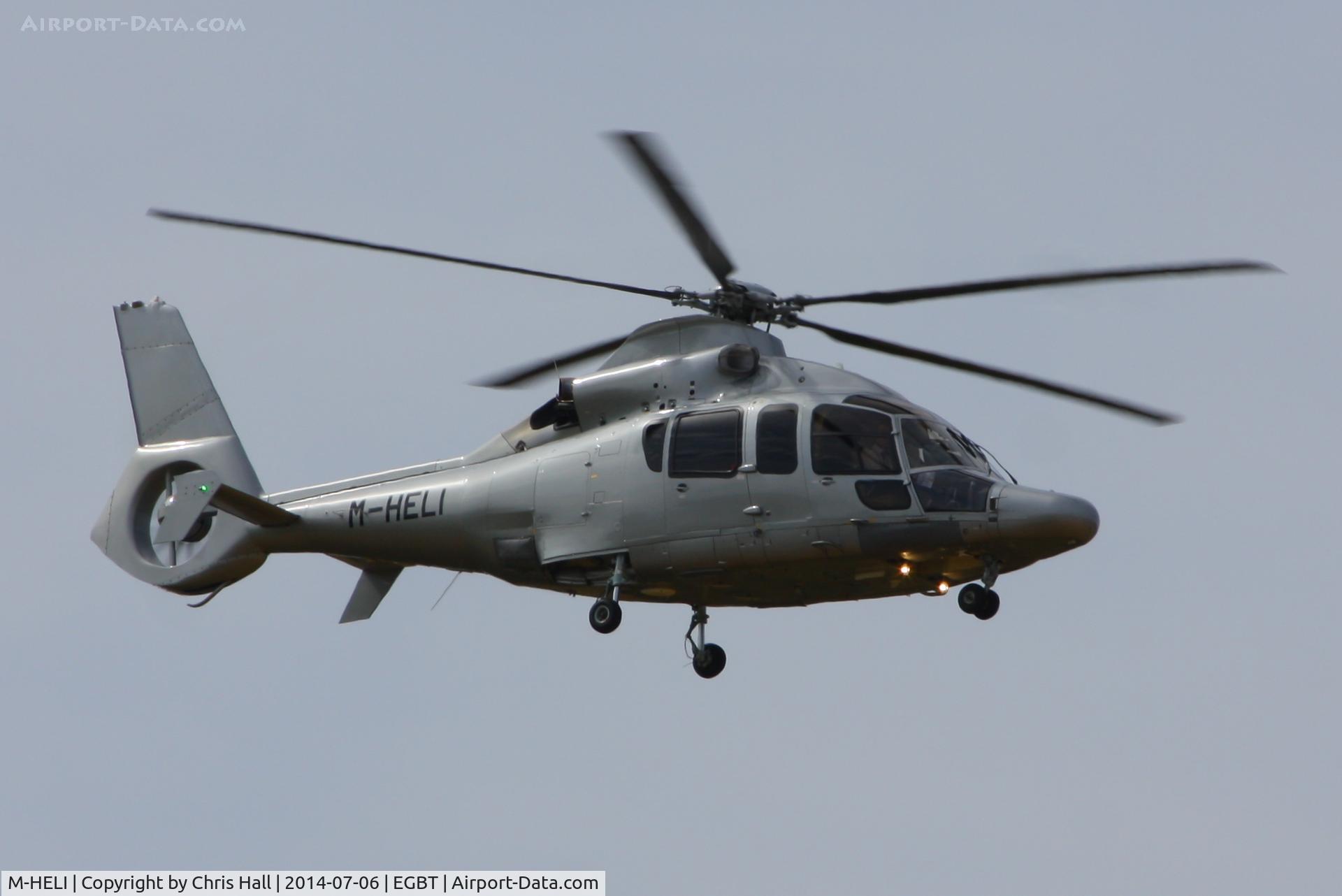 M-HELI, Eurocopter EC-155B-1 C/N 6898, ferrying race fans to the British F1 Grand Prix at Silverstone