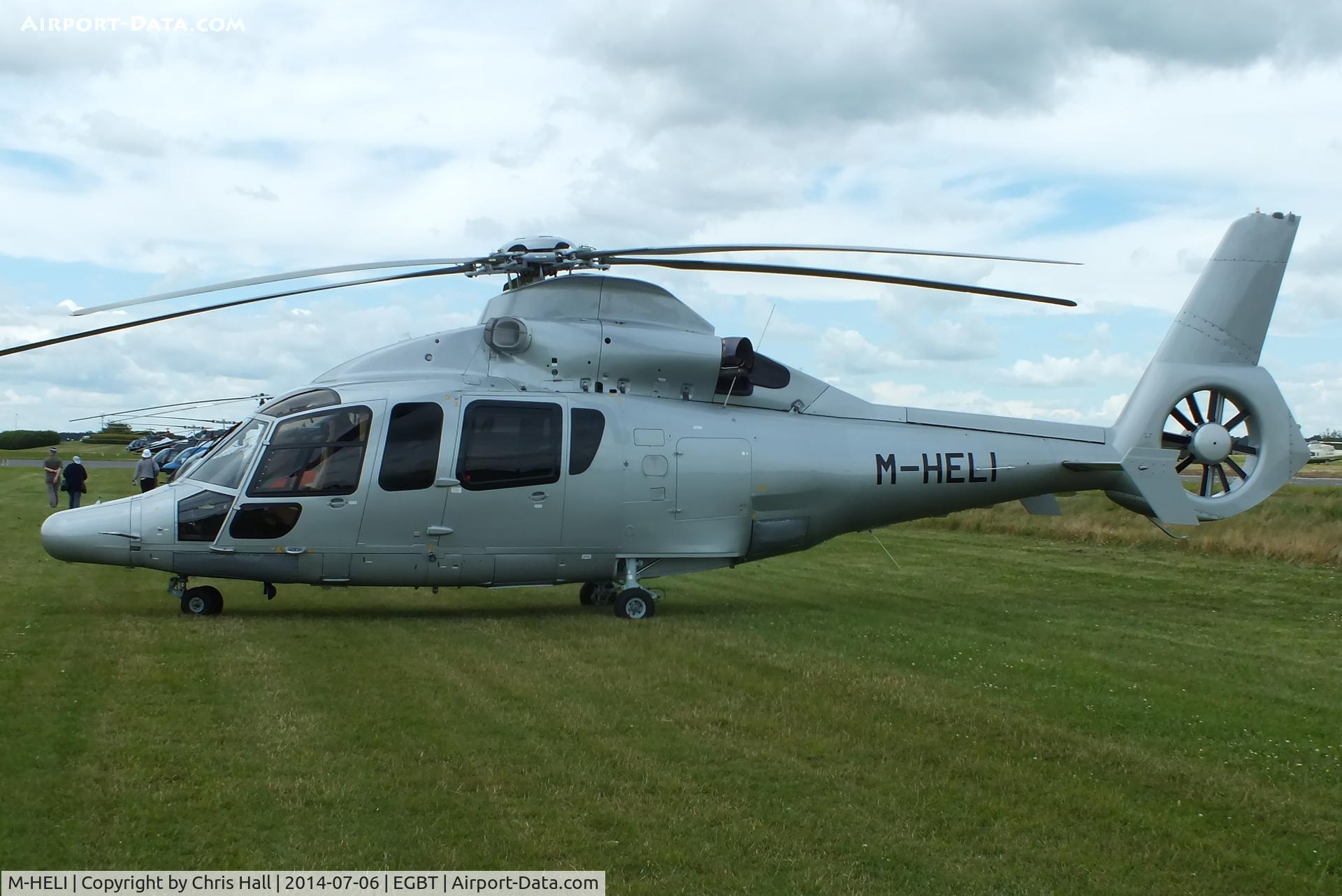 M-HELI, Eurocopter EC-155B-1 C/N 6898, ferrying race fans to the British F1 Grand Prix at Silverstone