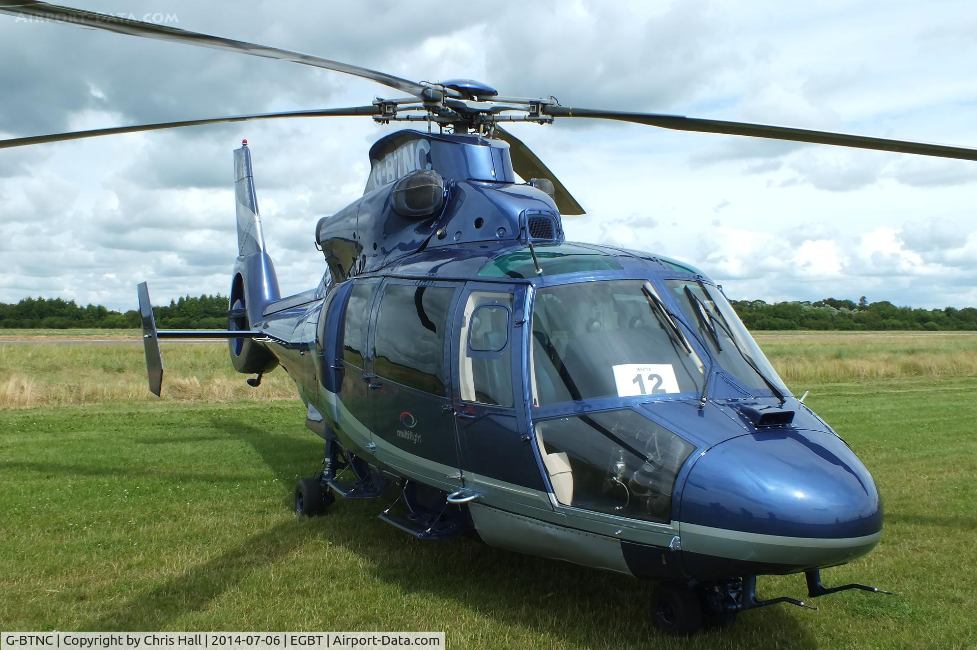 G-BTNC, 1991 Aerospatiale AS-365N-2 Dauphin C/N 6409, ferrying race fans to the British F1 Grand Prix at Silverstone