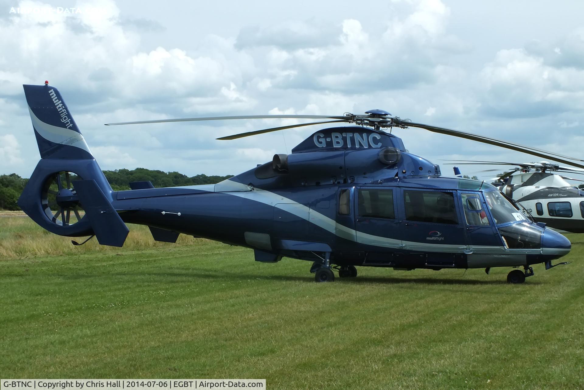 G-BTNC, 1991 Aerospatiale AS-365N-2 Dauphin C/N 6409, ferrying race fans to the British F1 Grand Prix at Silverstone
