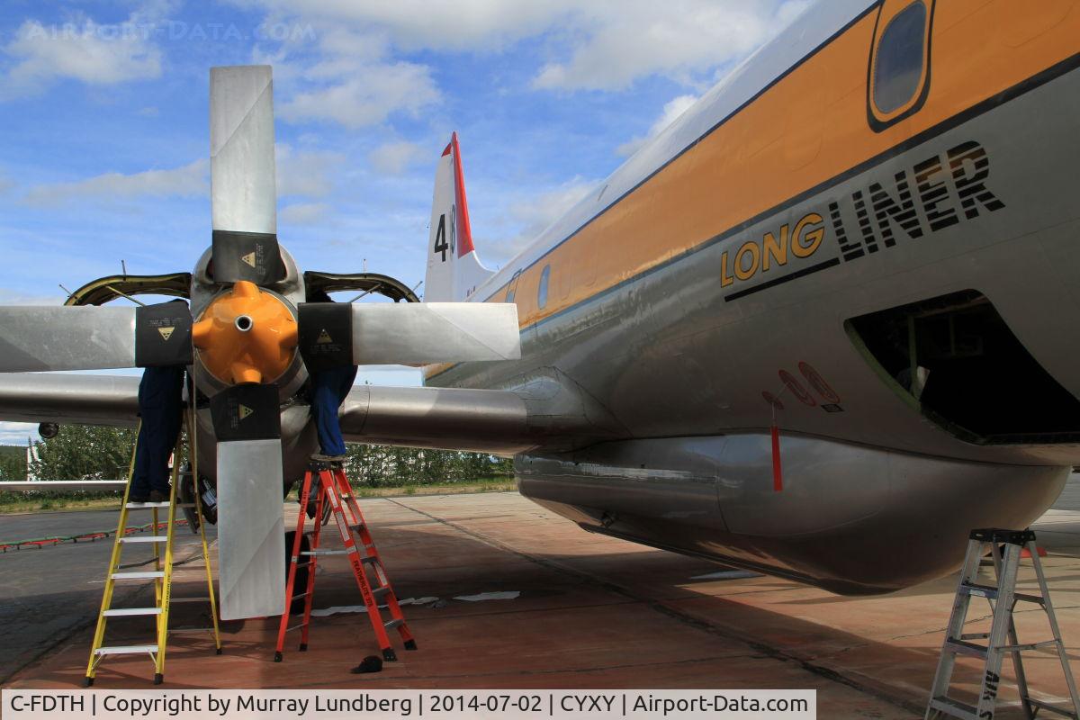 C-FDTH, 1959 Lockheed L-188A Electra C/N 1038, Maintenance being done at the Whitehorse, Yukon, fire base.