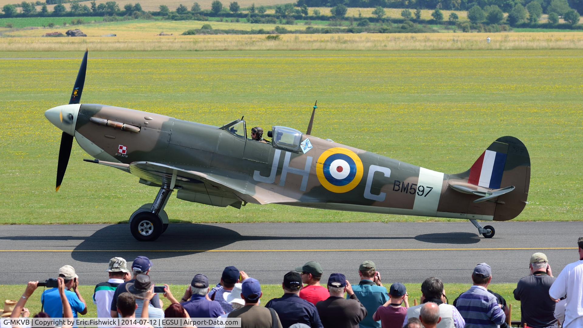 G-MKVB, 1942 Supermarine 349 Spitfire LF.Vb C/N CBAF.2461, 5. BM597 with a highly appreciative crowd at The Flying Legends Air Show, IWM Duxford. July,2014.
