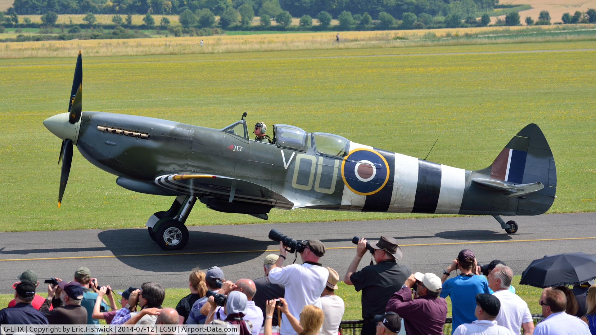 G-LFIX, 1944 Supermarine 509 Spitfire LF.IX (T.IX) C/N CBAF.8463, 5. G-LFIX with a highly appreciative crowd at The Flying Legends Air Show, IWM Duxford. July,2014.