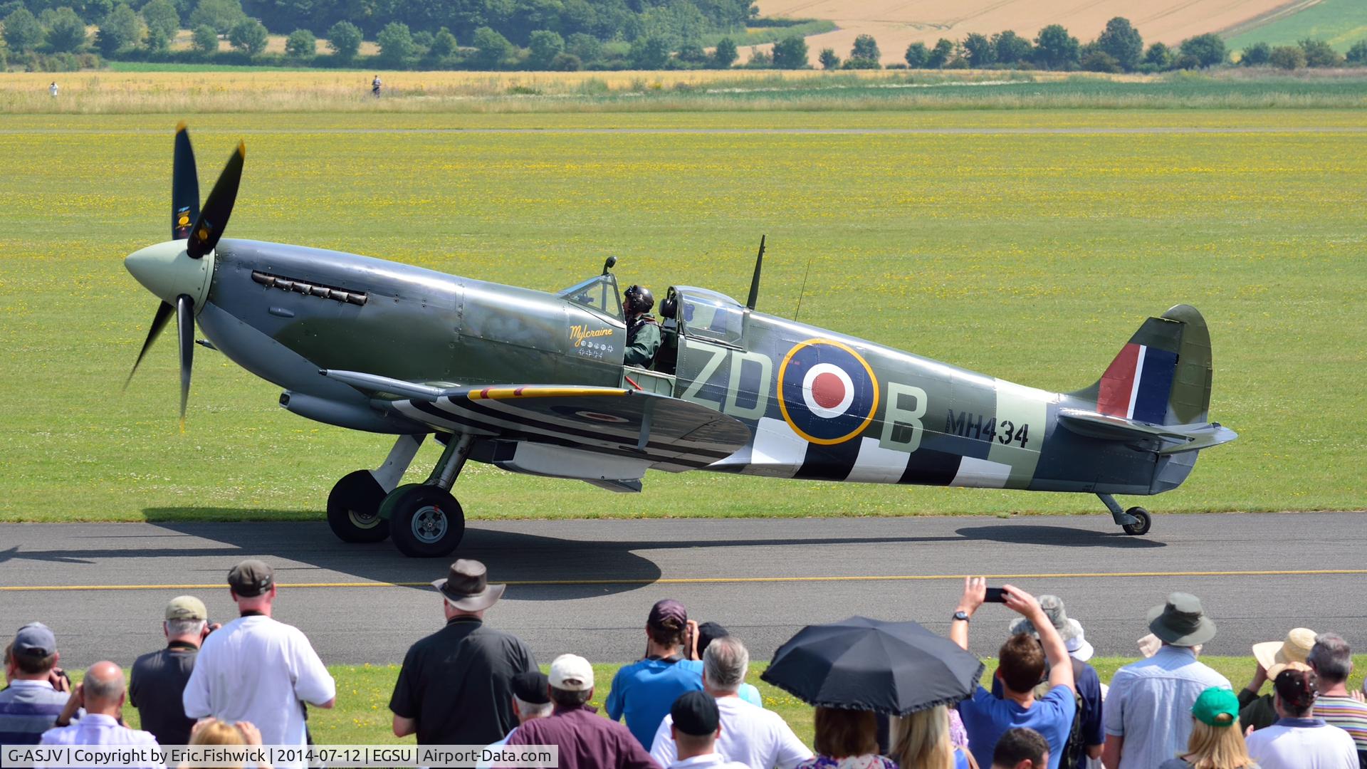 G-ASJV, 1943 Supermarine 361 Spitfire LF.IXb C/N CBAF.IX.552, 5. MH434 with a highly appreciative crowd at The Flying Legends Air Show, IWM Duxford. July,2014.