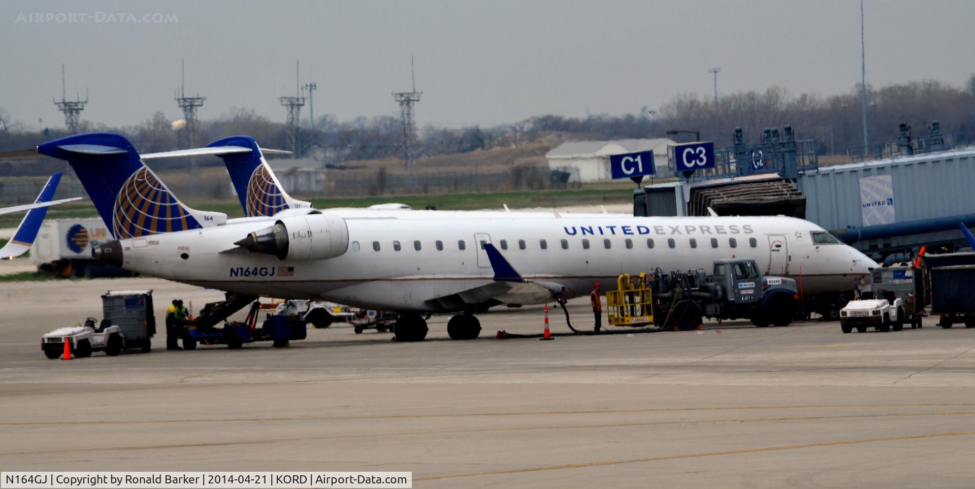 N164GJ, 2006 Bombardier CRJ-702 (CL-600-2C10) Regional Jet C/N 10256, Gate C3  Refueling