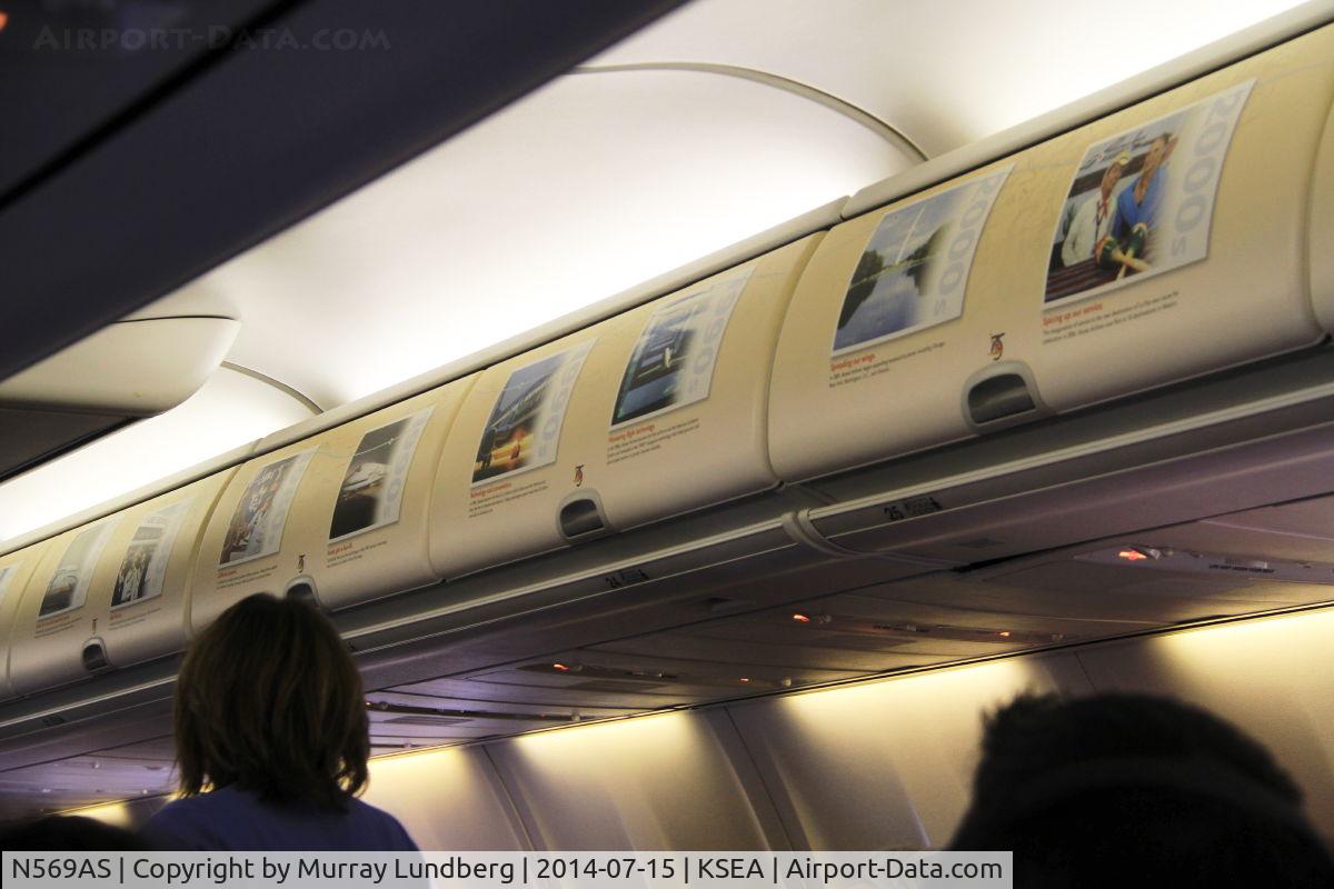 N569AS, 2007 Boeing 737-890 C/N 35184, Interior of N569AS is decorated with photos and notes from Alaska aviation history.