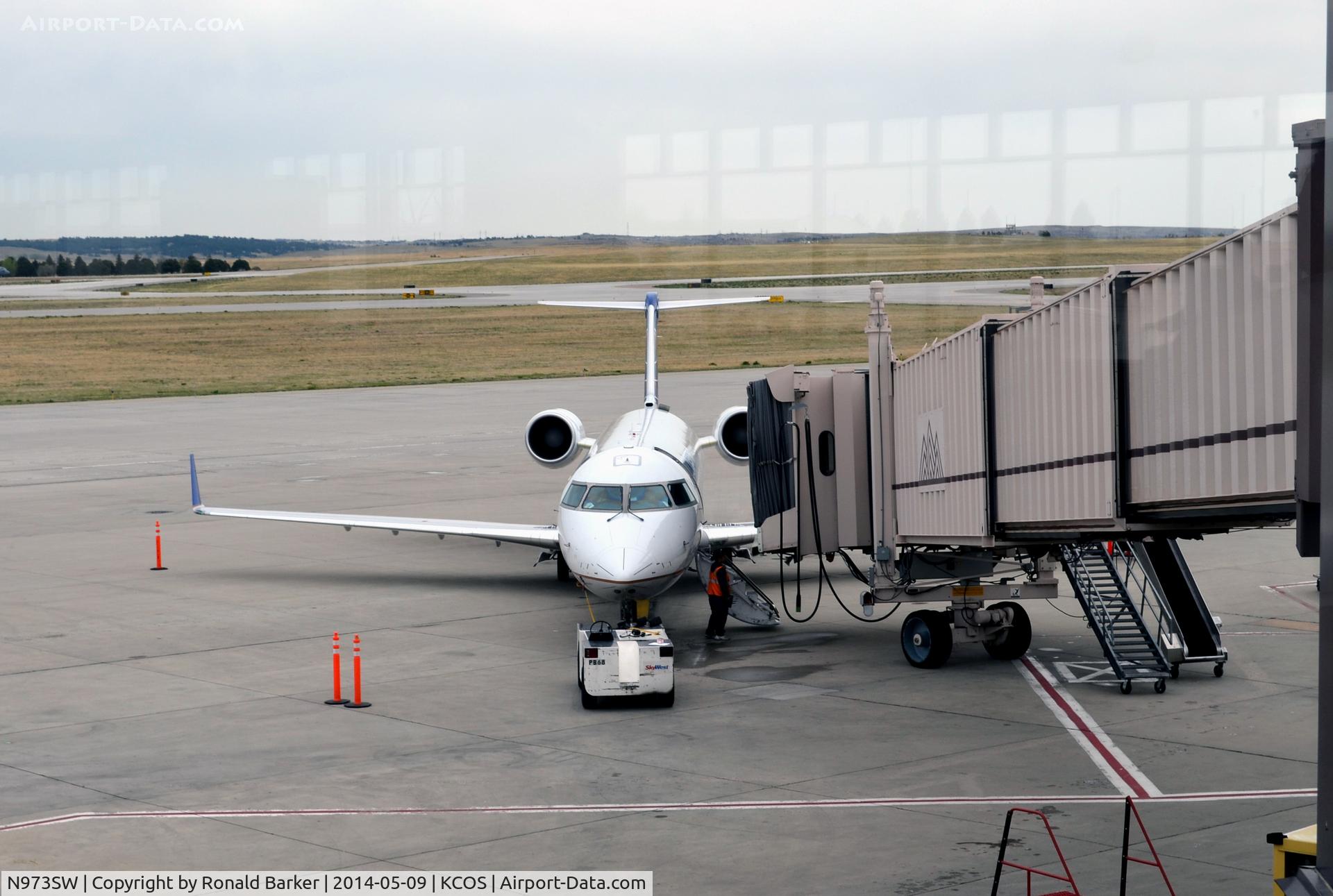 N973SW, 2004 Bombardier CRJ-200ER (CL-600-2B19) C/N 7949, Parked at the gate COS