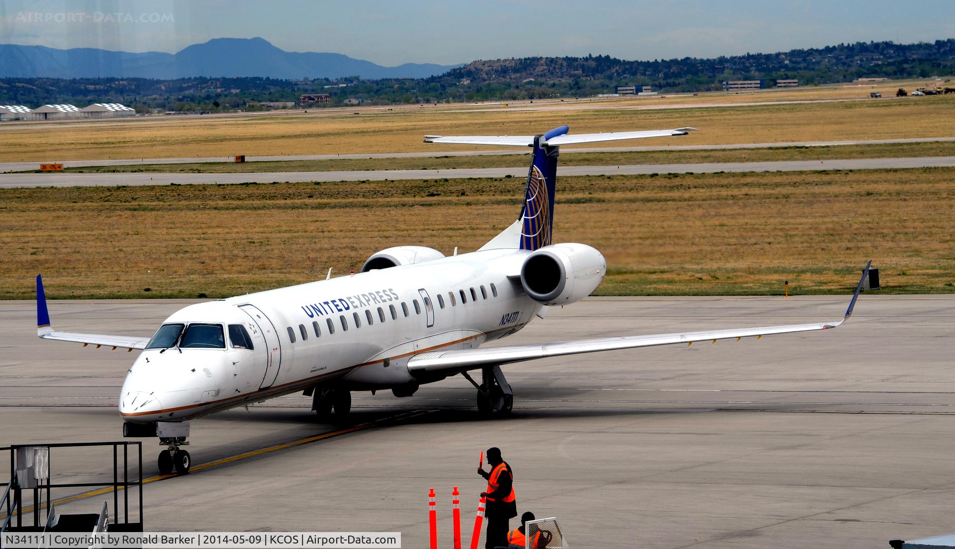 N34111, 2002 Embraer ERJ-145XR (EMB-145XR) C/N 145659, Taxi to park COS