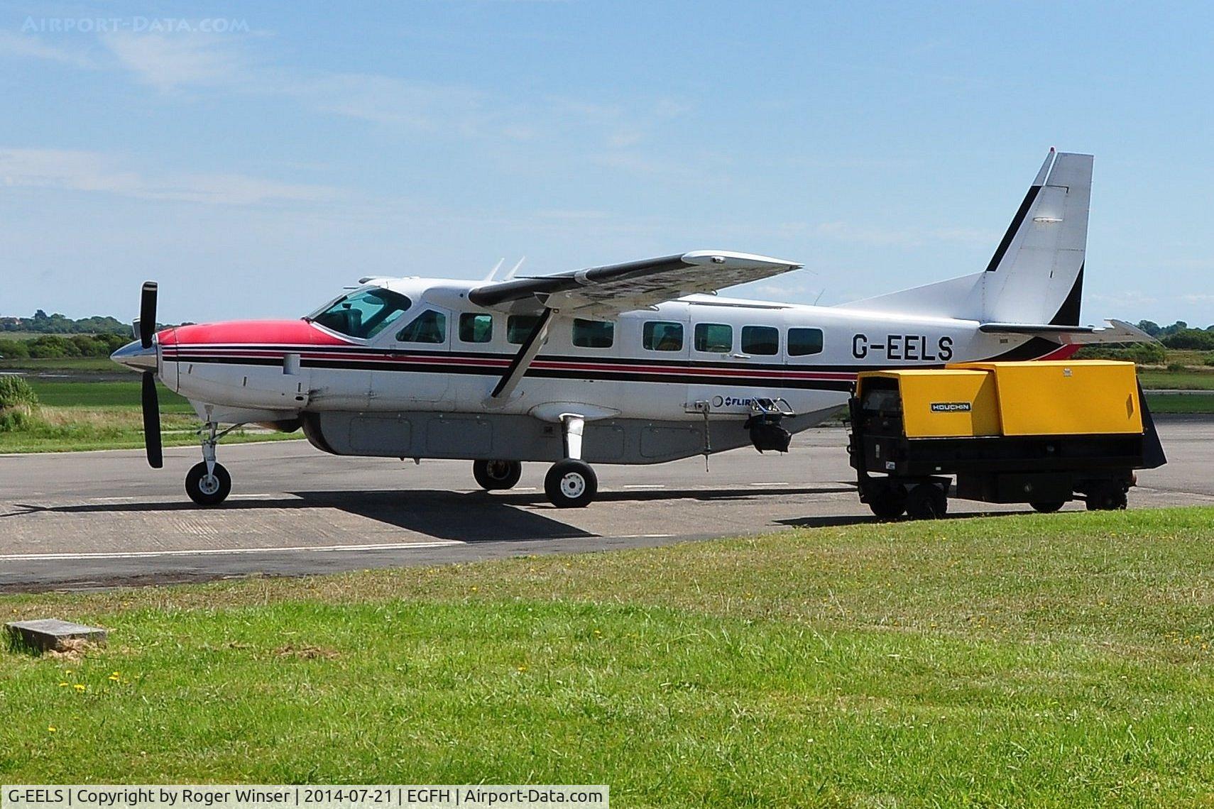 G-EELS, 1997 Cessna 208B Grand Caravan C/N 208B0619, Visiting Grand Caravan fitted with a TV camera to cover a golf tournament.
