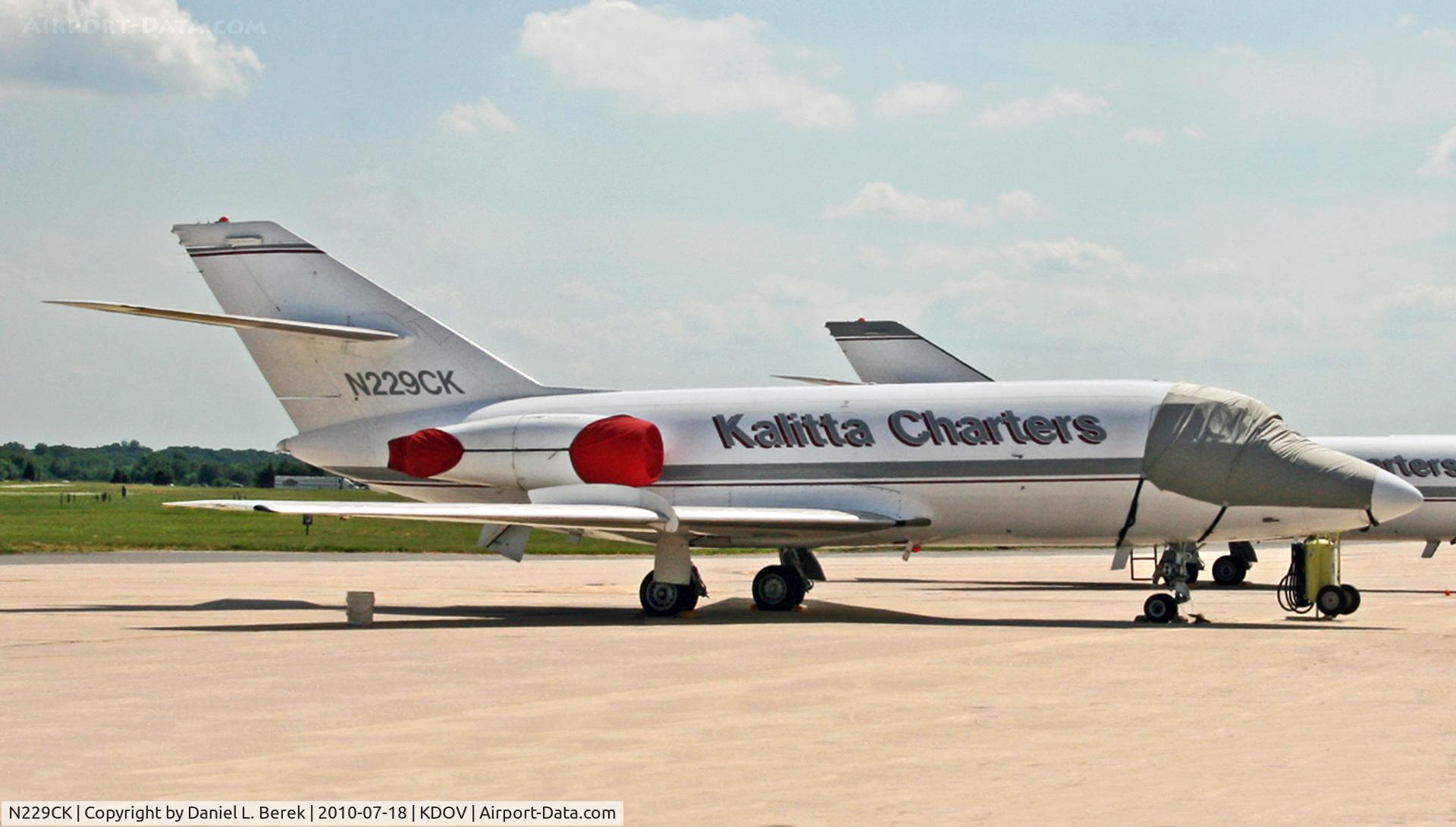 N229CK, 1970 Dassault Fan Jet Falcon (20D) C/N 229, An old classic biz-jet freight dog sits on the tarmac at Dover Air Force Base, far from the primary military base and close to the southern end, where the Air Mobility Command Museum is.