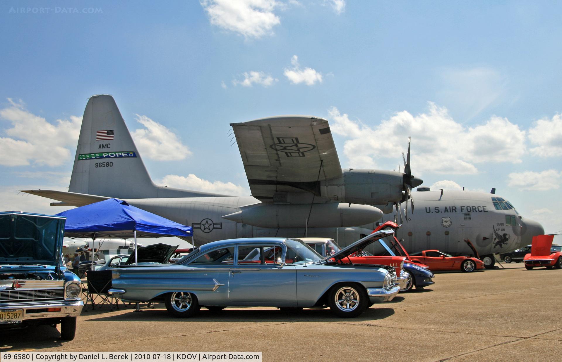 69-6580, 1969 Lockheed C-130E Hercules C/N 382-4356, A very nice 1969 Hercules towers over a sea of classic cars.