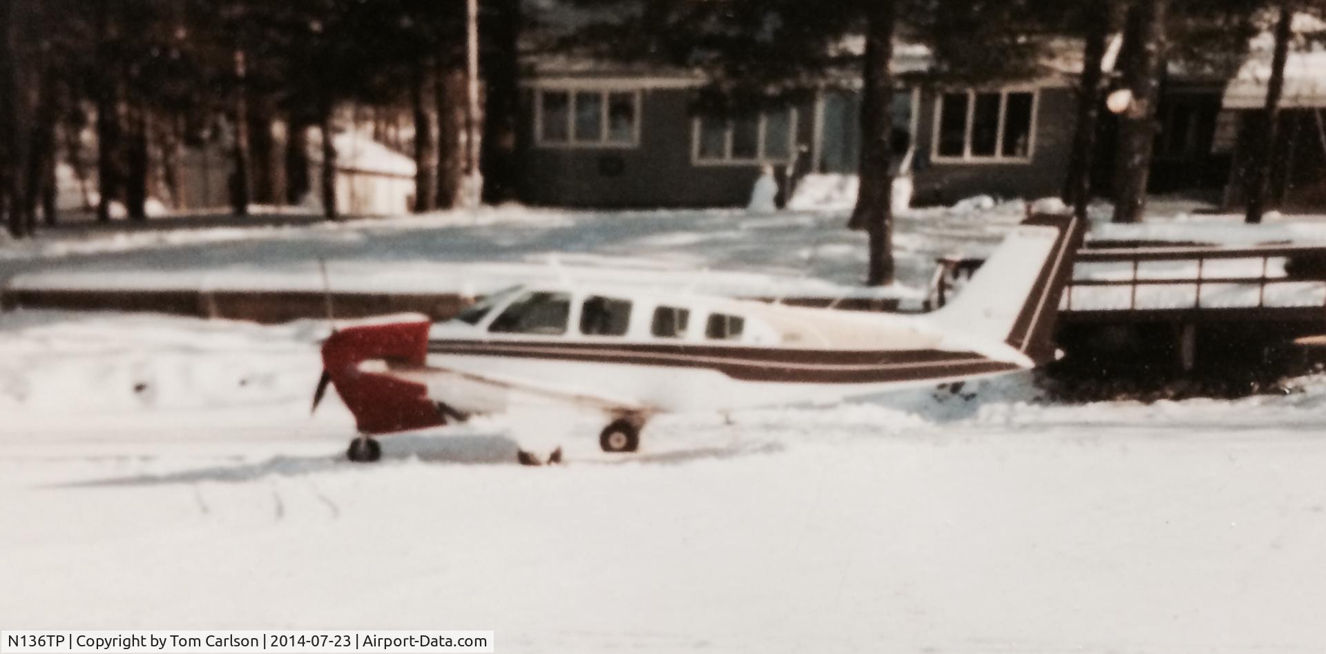 N136TP, 1977 Beech A36 Bonanza 36 C/N E-1176, Formerly N-23530, parked on a frozen lake in front of our cabin in Balsam Lake, WI.  We kept a 3500 foot runway plowed during the winter which made it very convenient to enjoy a day or two of snowmobiling.