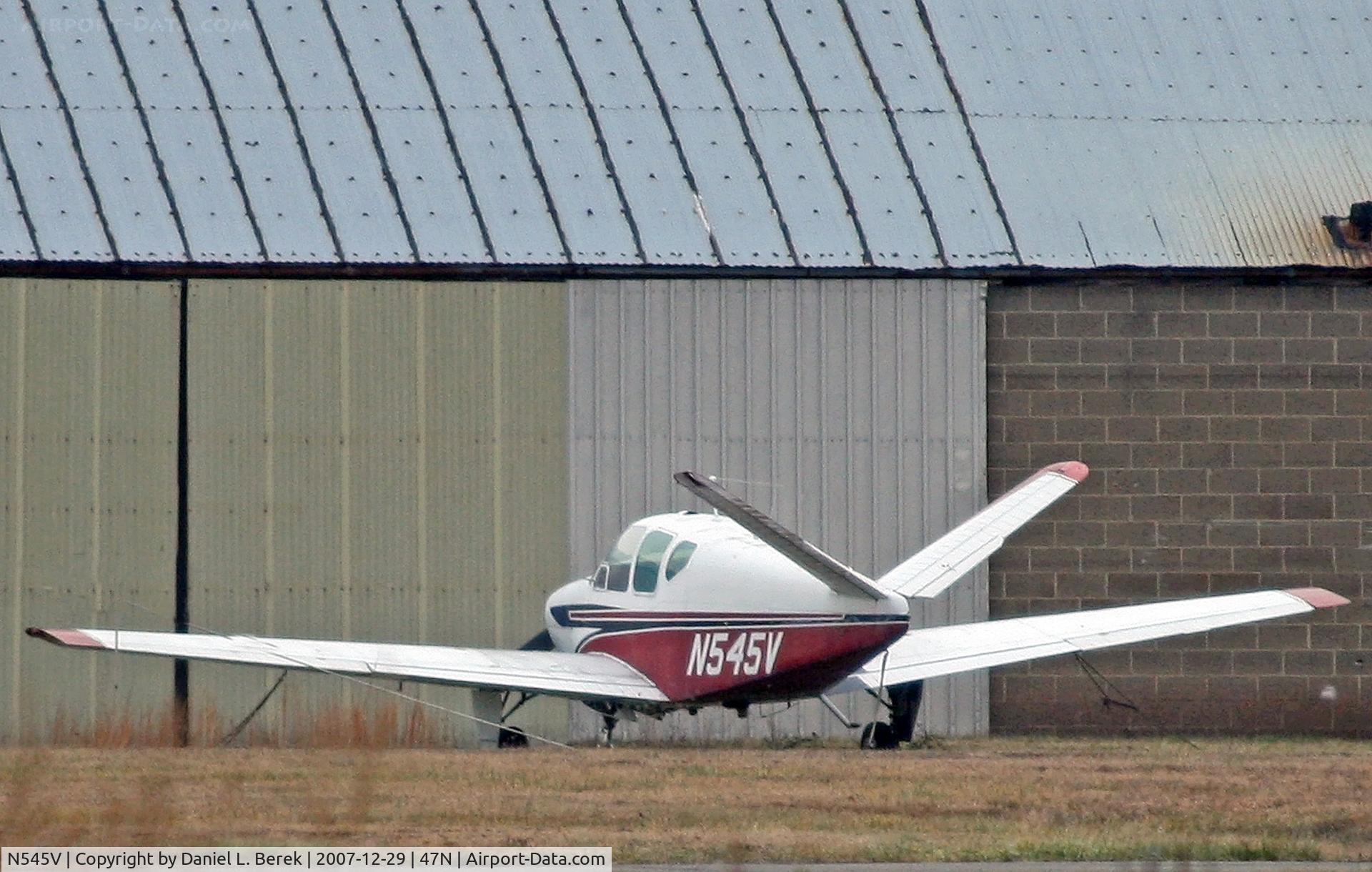 N545V, 1960 Beech M35 Bonanza C/N D-6321, Nice classic Beech seen on the opposite side of Central Jersey Regional Airport.