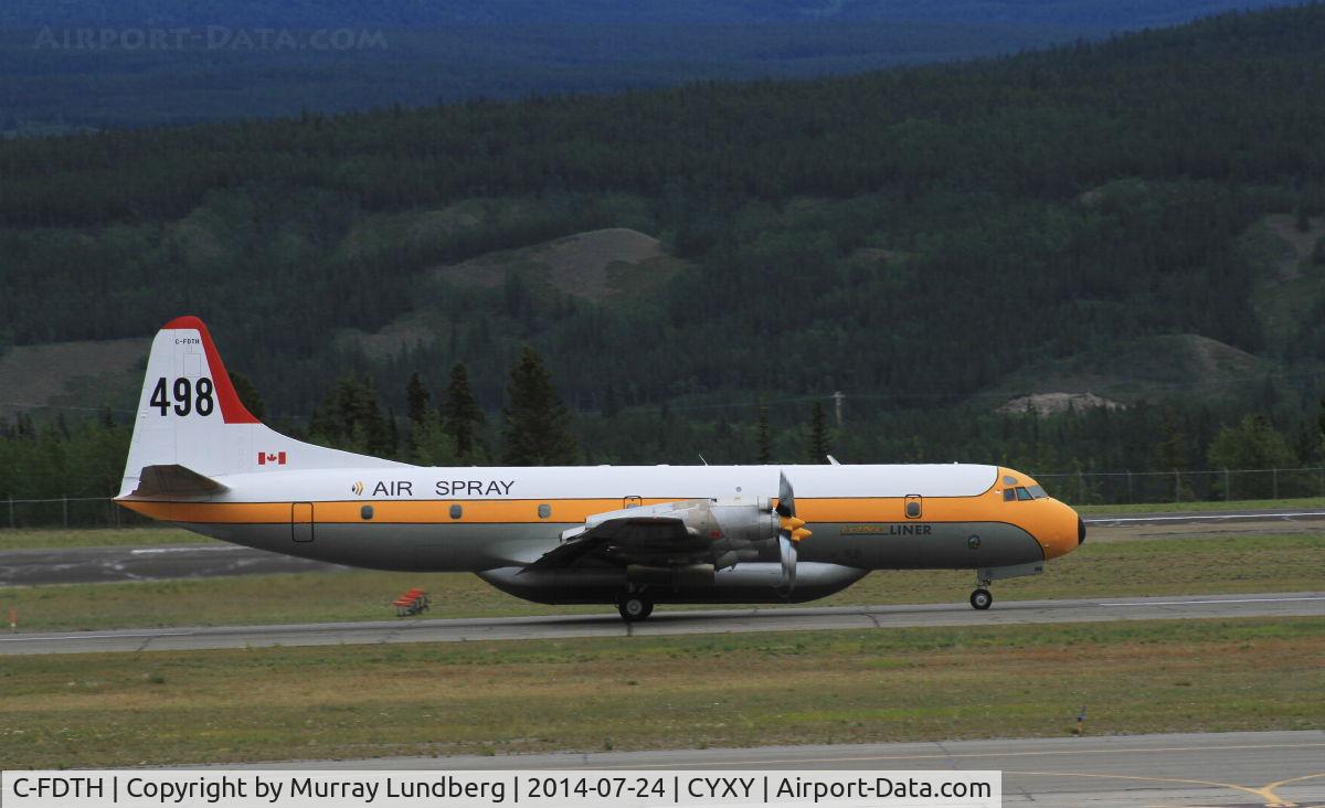C-FDTH, 1959 Lockheed L-188A Electra C/N 1038, Taking off at Whitehorse, Yukon.