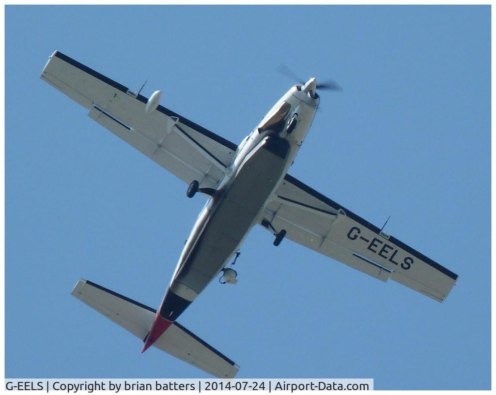 G-EELS, 1997 Cessna 208B Grand Caravan C/N 208B0619, passing overhead whilst photographing the senior open championship at the RPGC Porthcawl,taken from the garden at home during its many circuits.