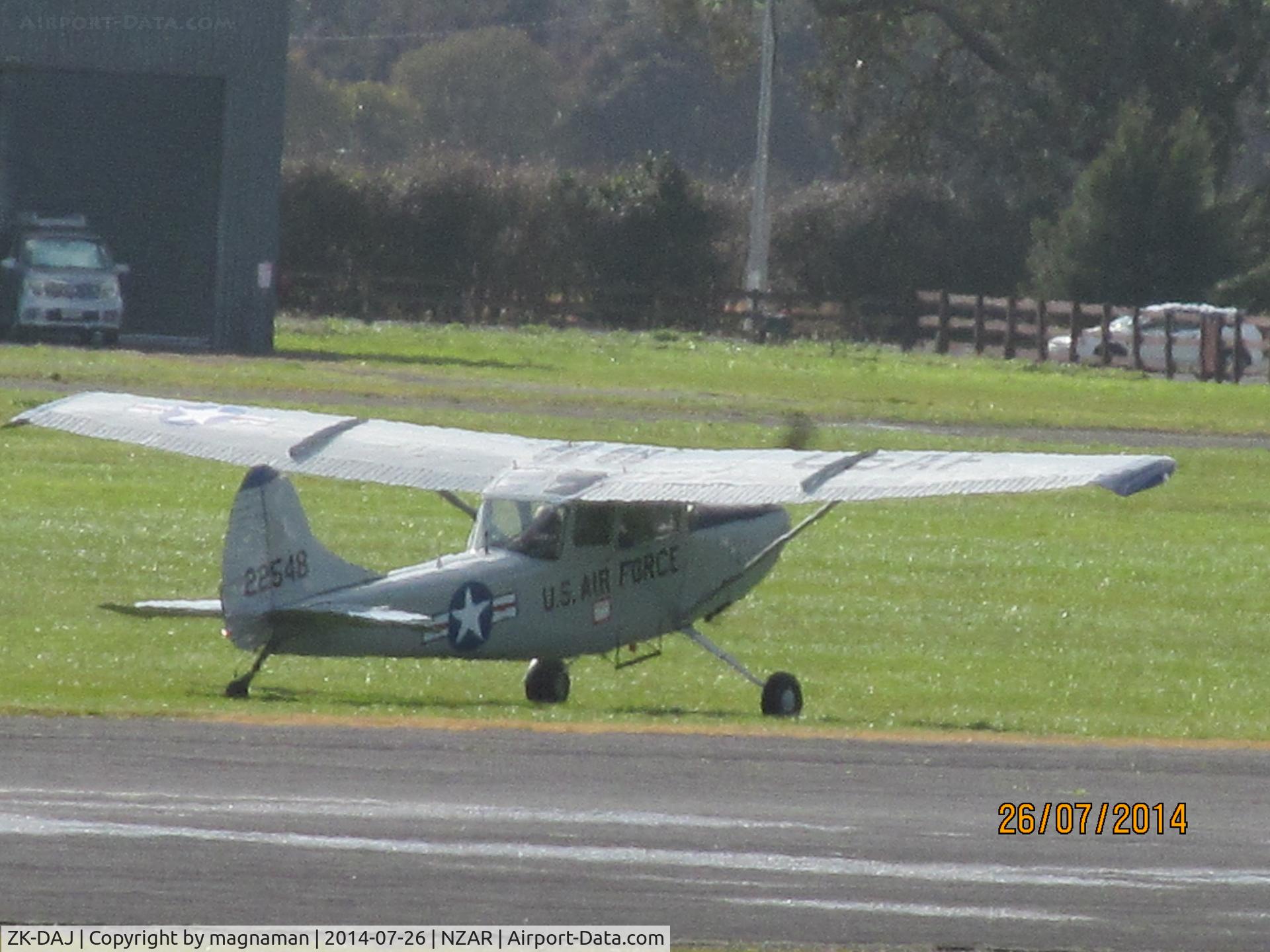 ZK-DAJ, Cessna 305A C/N 22548, viewed from café with zoom