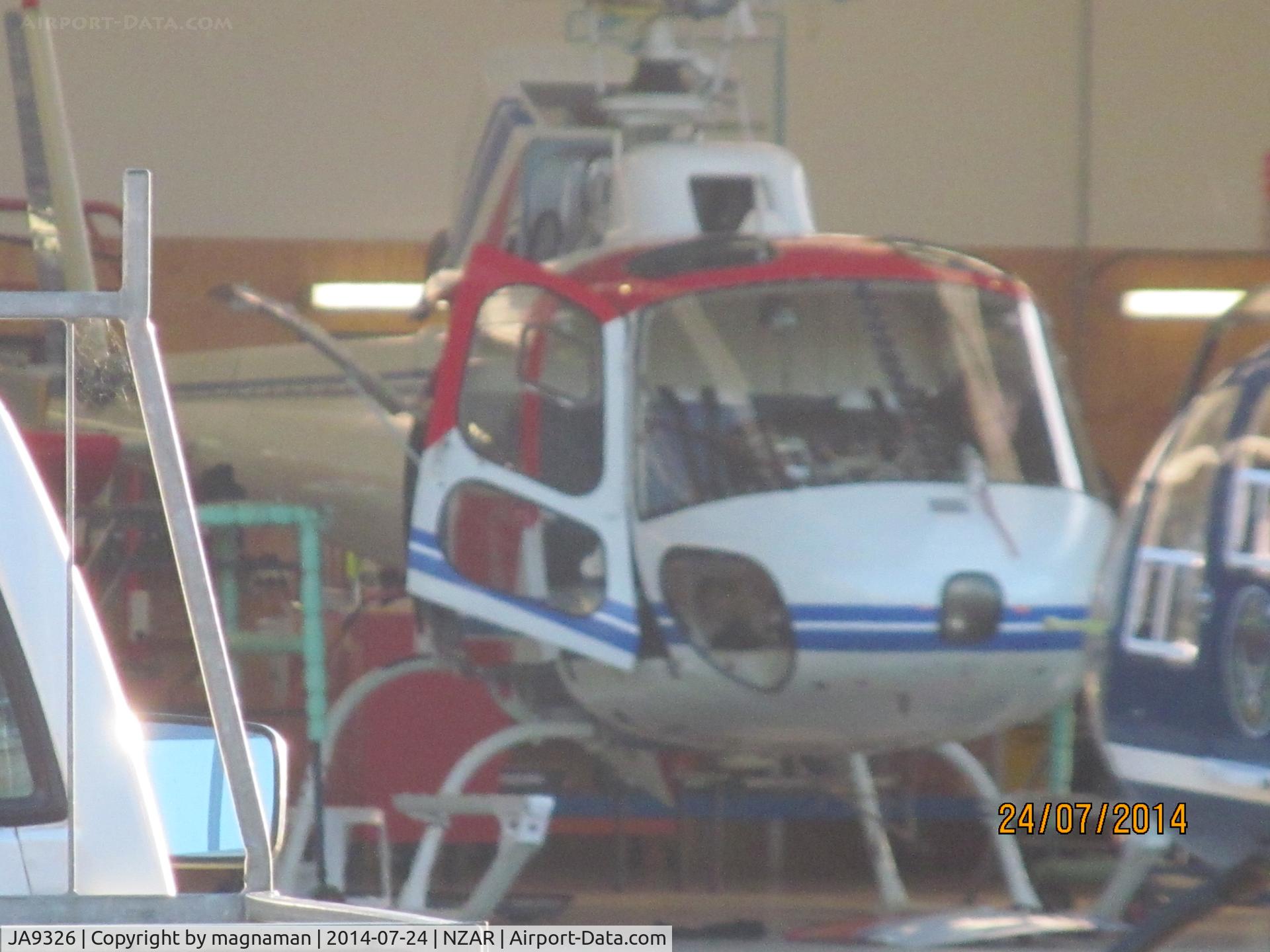 JA9326, Aerospatiale AS-350B Ecureuil C/N 1557, in oceania hangar (along with JA9316 - which has orange band rather than blue)