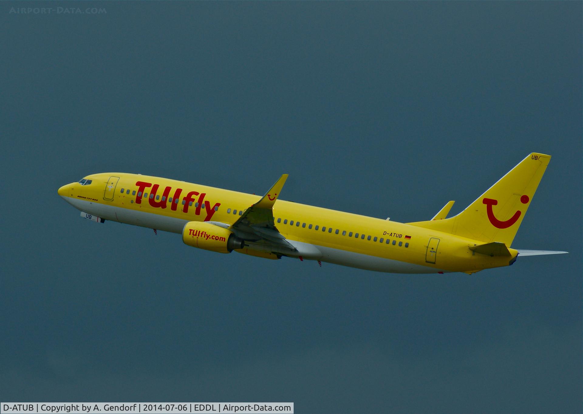 D-ATUB, 2010 Boeing 737-8K5 C/N 37247, TUIfly, is here taking off in front of a dark raincloud, at Düsseldorf Int'l(EDDL)