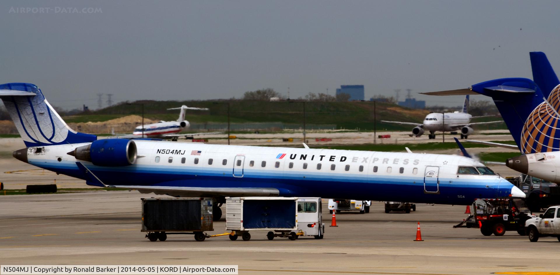 N504MJ, 2002 Bombardier CRJ-700 (CL-600-2C10) Regional Jet C/N 10066, Parked O'Hare