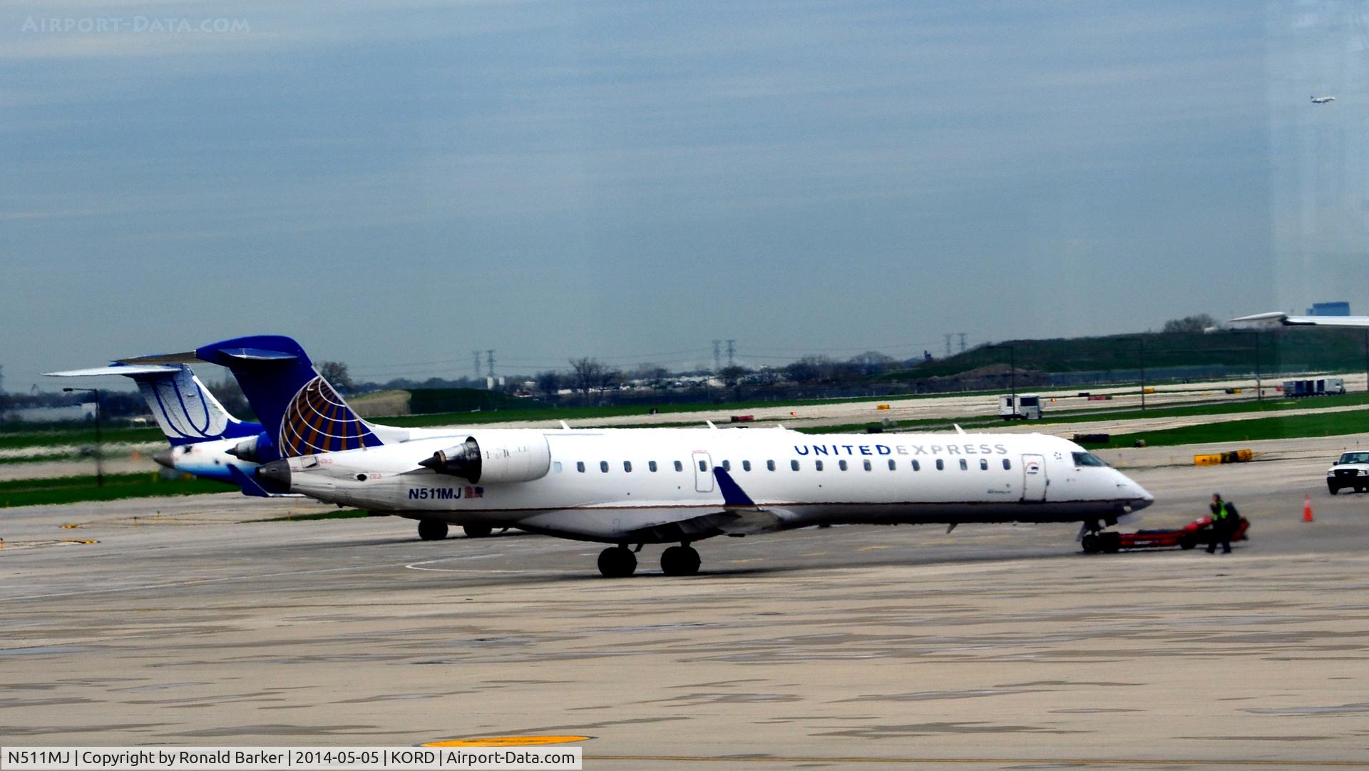 N511MJ, 2003 Bombardier CRJ-700 (CL-600-2C10) Regional Jet C/N 10104, Pushback O'Hare