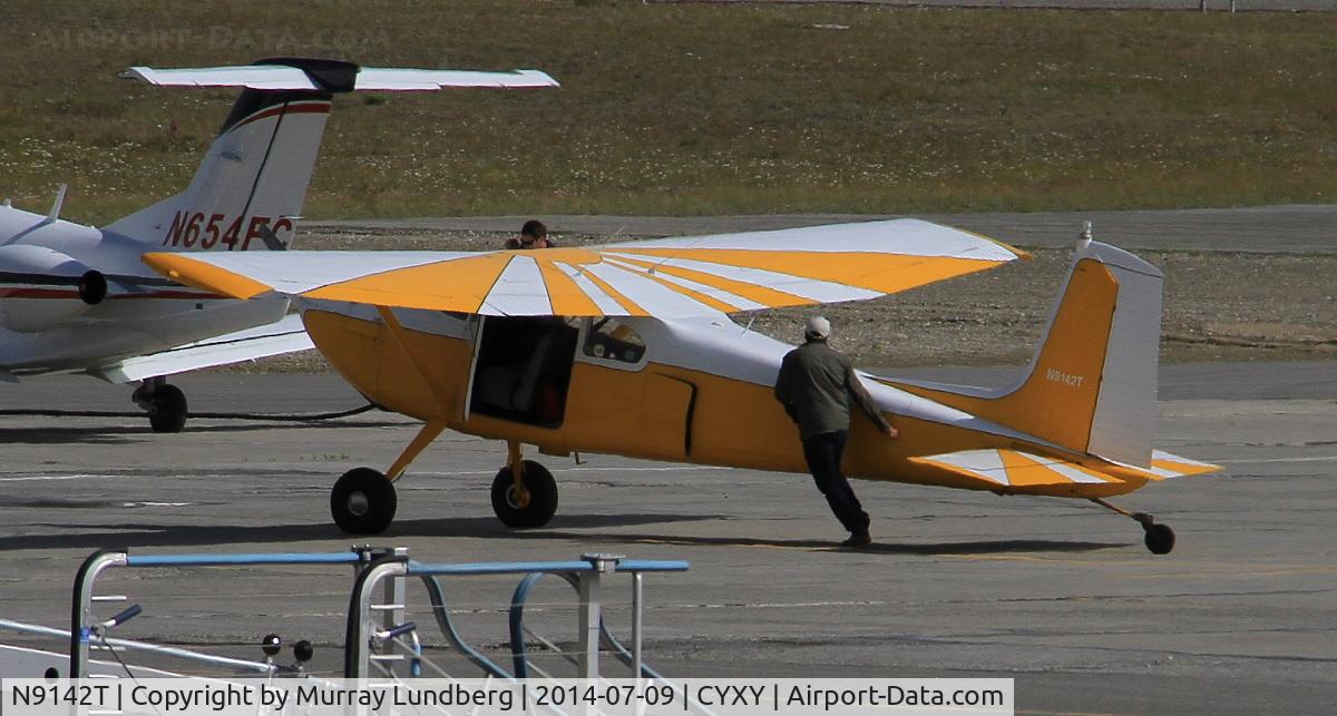 N9142T, 1959 Cessna 180B C/N 50642, Being pushed to the fuel station at Whitehorse,m Yukon.