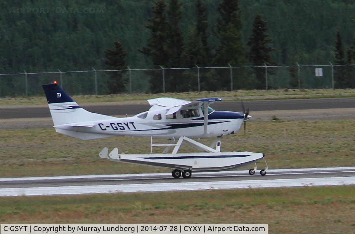 C-GSYT, Cessna TU206G Turbo Stationair C/N U20606744, On amphibious floats, taking off at Whitehorse, Yukon.