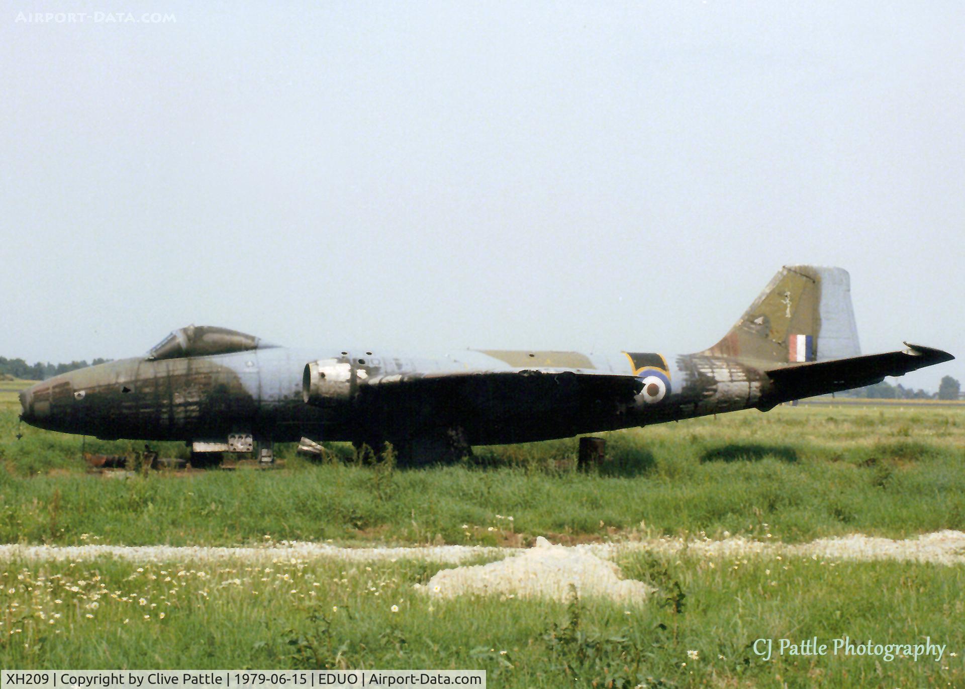 XH209, 1956 English Electric Canberra B(1).8 C/N Not found XH209, Scanned from print. Partly singed EE Canberra XH209 on the dump at RAF Gutersloh in June '79, its services no longer required as a decoy at the airfield. An ex 16 Sqn RAF machine - you can see the 'Saint' image on the tail.