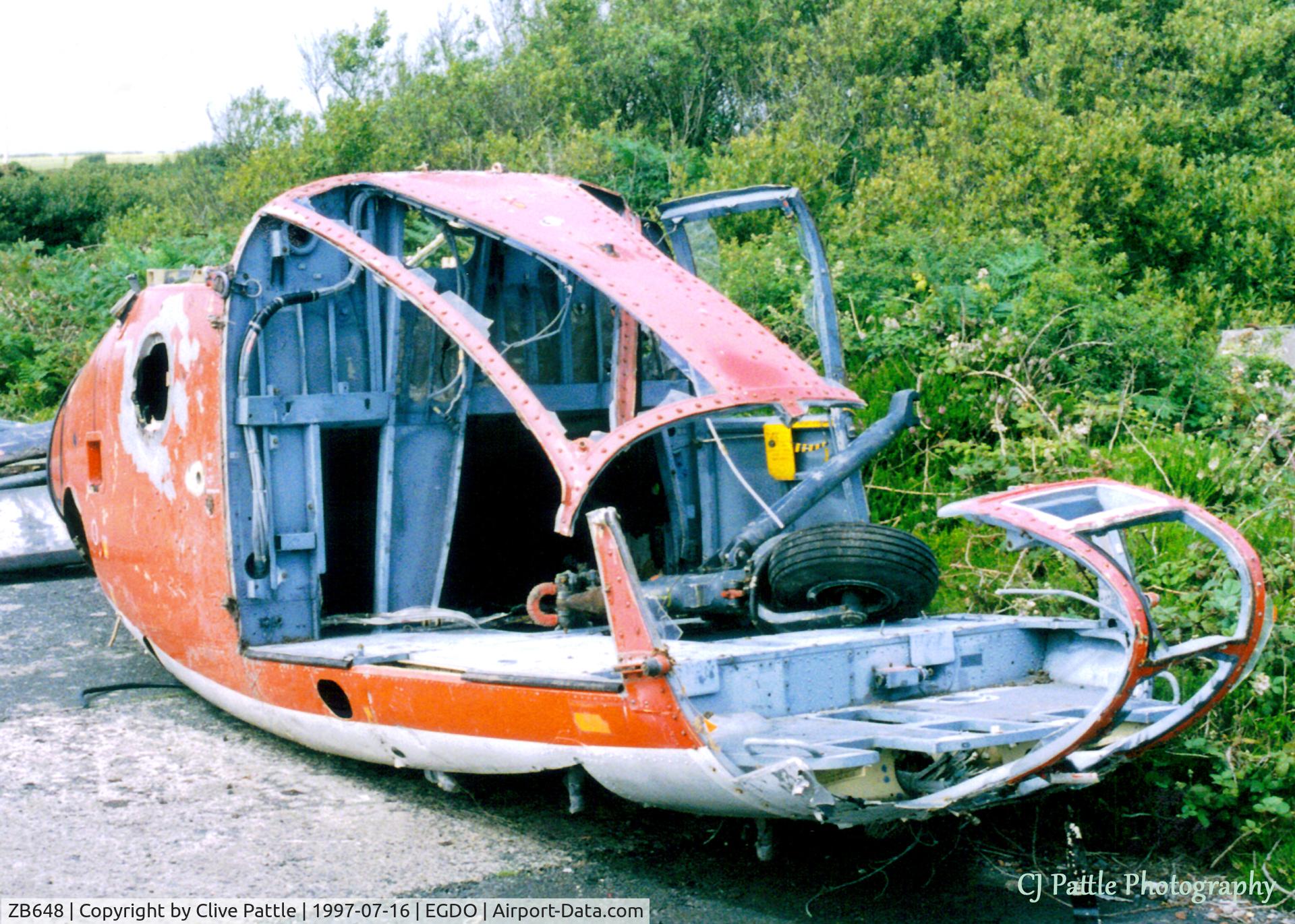 ZB648, 1984 Westland SA-341C Gazelle HT2 C/N 2011, Scanned from print, the pod remains of ZB648 lie at Predannack Fire Training School (EGDO in Jul '97. This a/c crashed 18.3.93 at Predannack