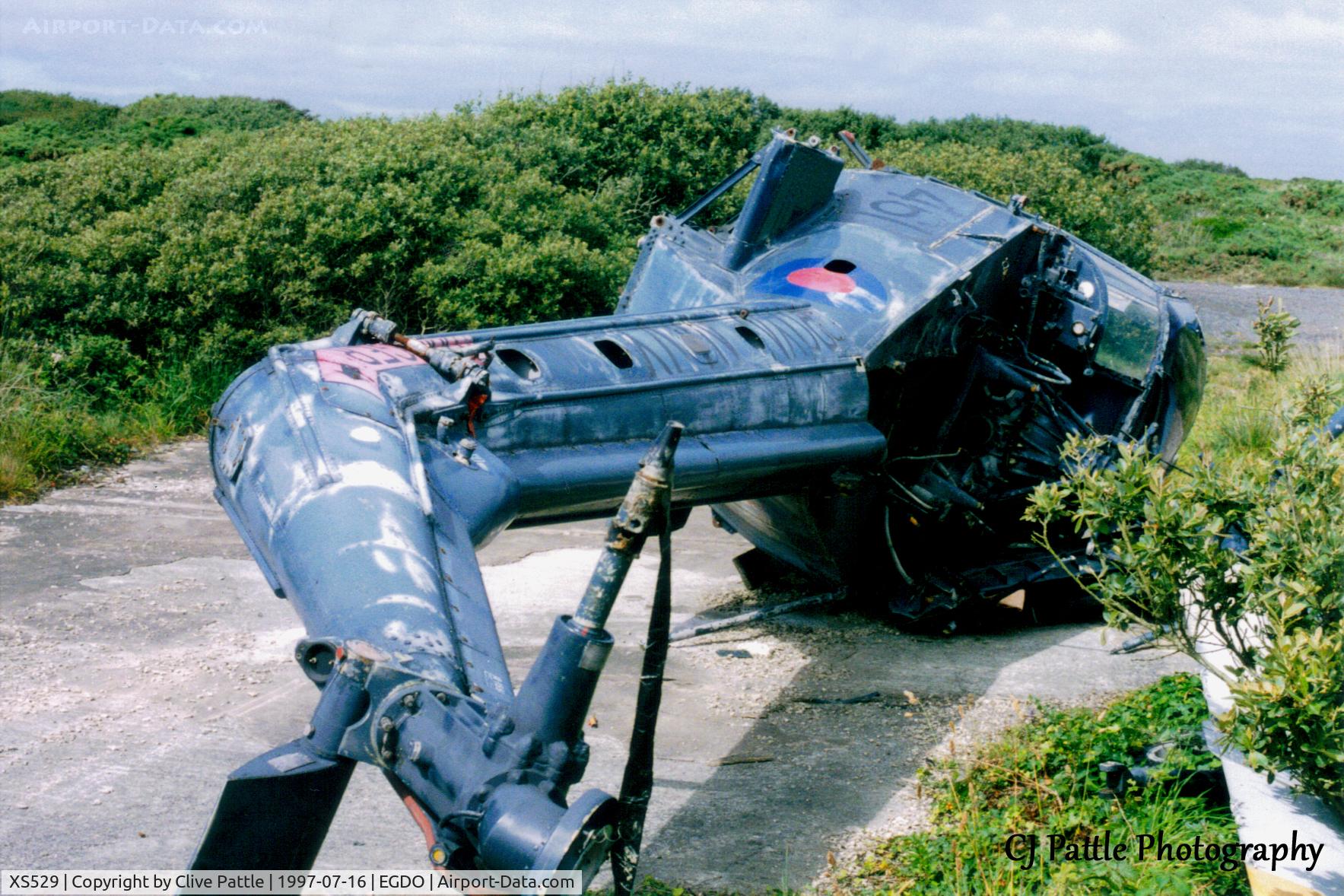 XS529, 1963 Westland Wasp HAS.1 C/N F.9556, Scanned from print. Ex 829 NAS Wasp HAS.1 XS529 remains lying at RNAS Predannack, Cornwall (EGDO) in July '97.  Previously based on HMS Tartar and HMS Galatea