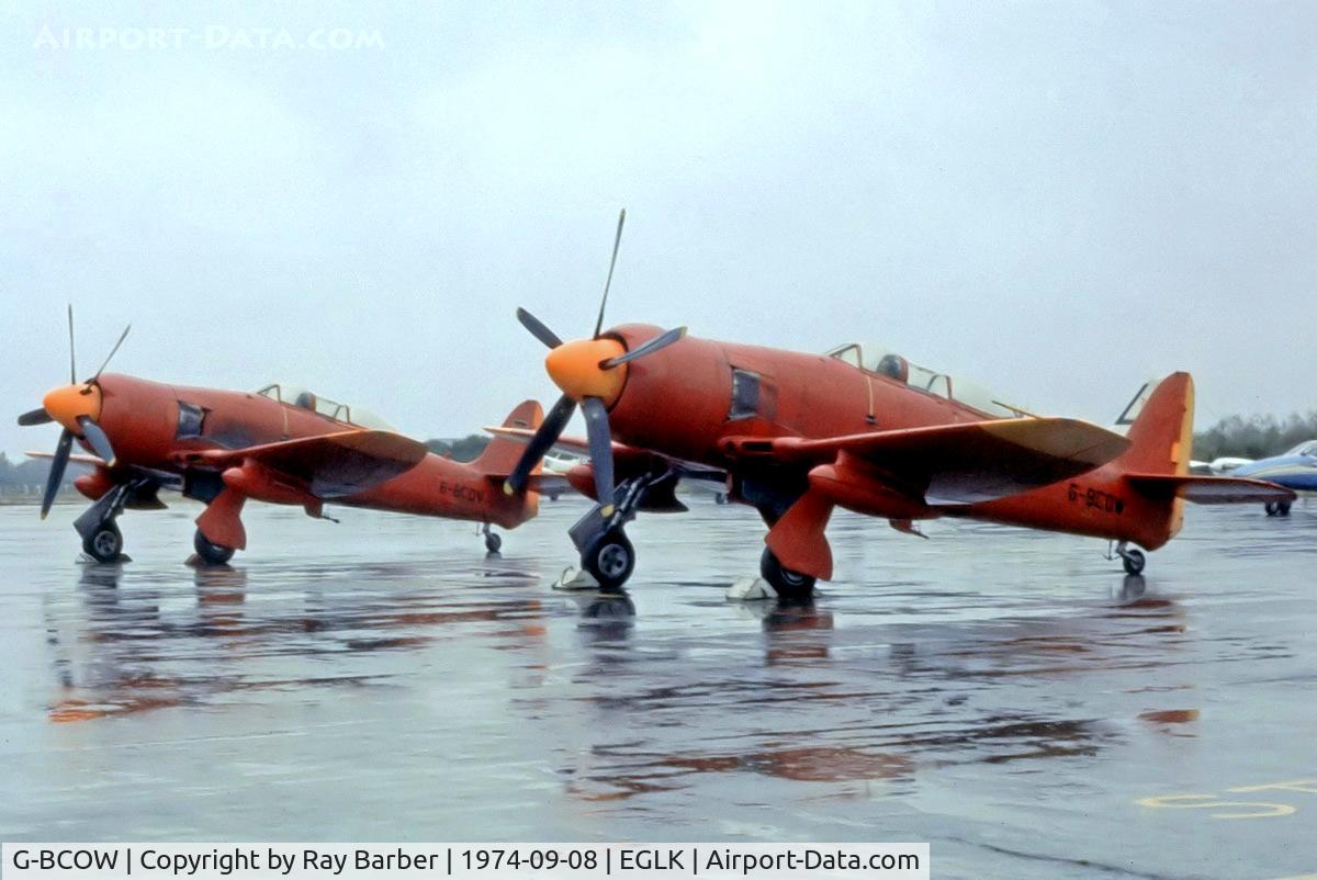 G-BCOW, 1949 Hawker Sea Fury T.20 C/N ES.3615, Hawker Sea Fury T.20S [ES.3615] (Fairoaks Aviation Services Ltd (D.Arnold) Blackebushe~G 08/09/1974. Seen here with G-BCOV in the background on a dull wet day. Image from a slide