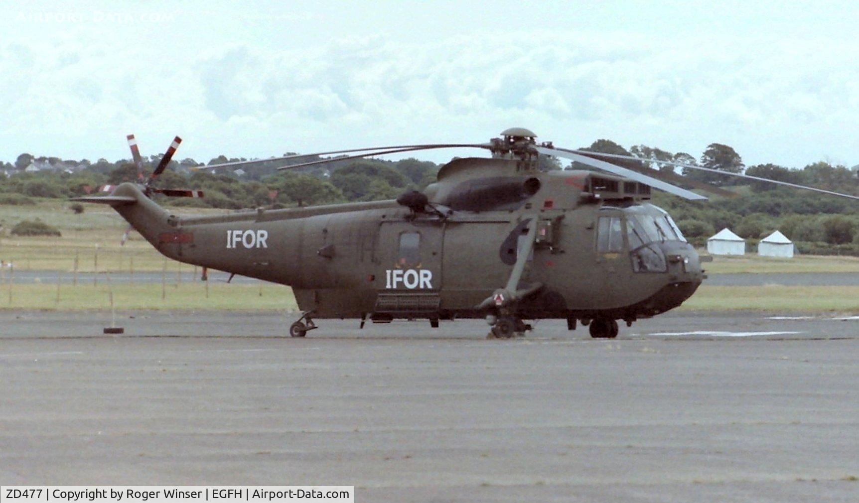 ZD477, 1984 Westland Sea King HC.4 C/N WA932, Visiting Royal Navy Sea King HC.4 helicopter coded (Y)H from 845 NAS with IFOR markngs.Summer 1996.