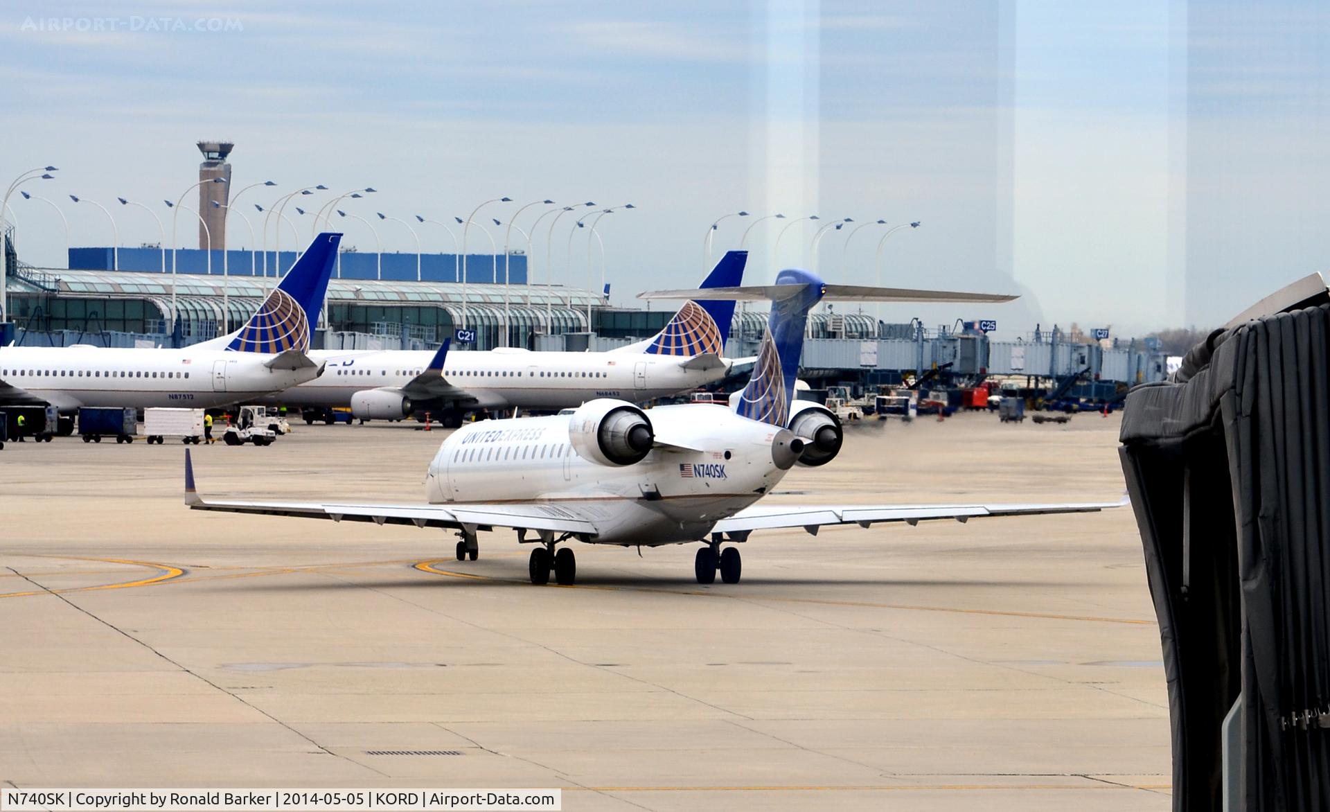 N740SK, 2005 Bombardier CRJ-701 (CL-600-2C10) Regional Jet C/N 10196, Taxi for takeoff O'Hare