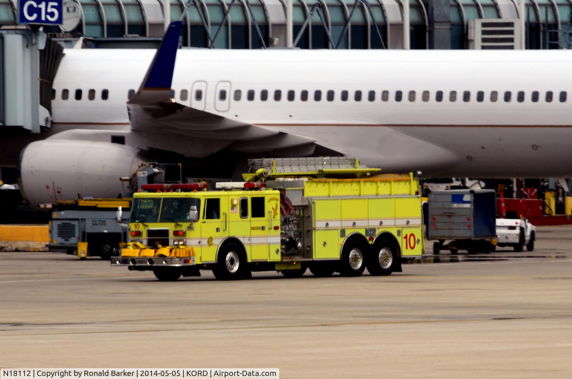 N18112, 1995 Boeing 757-224 C/N 27302, Fire truck passing by aircraft  O'Hare