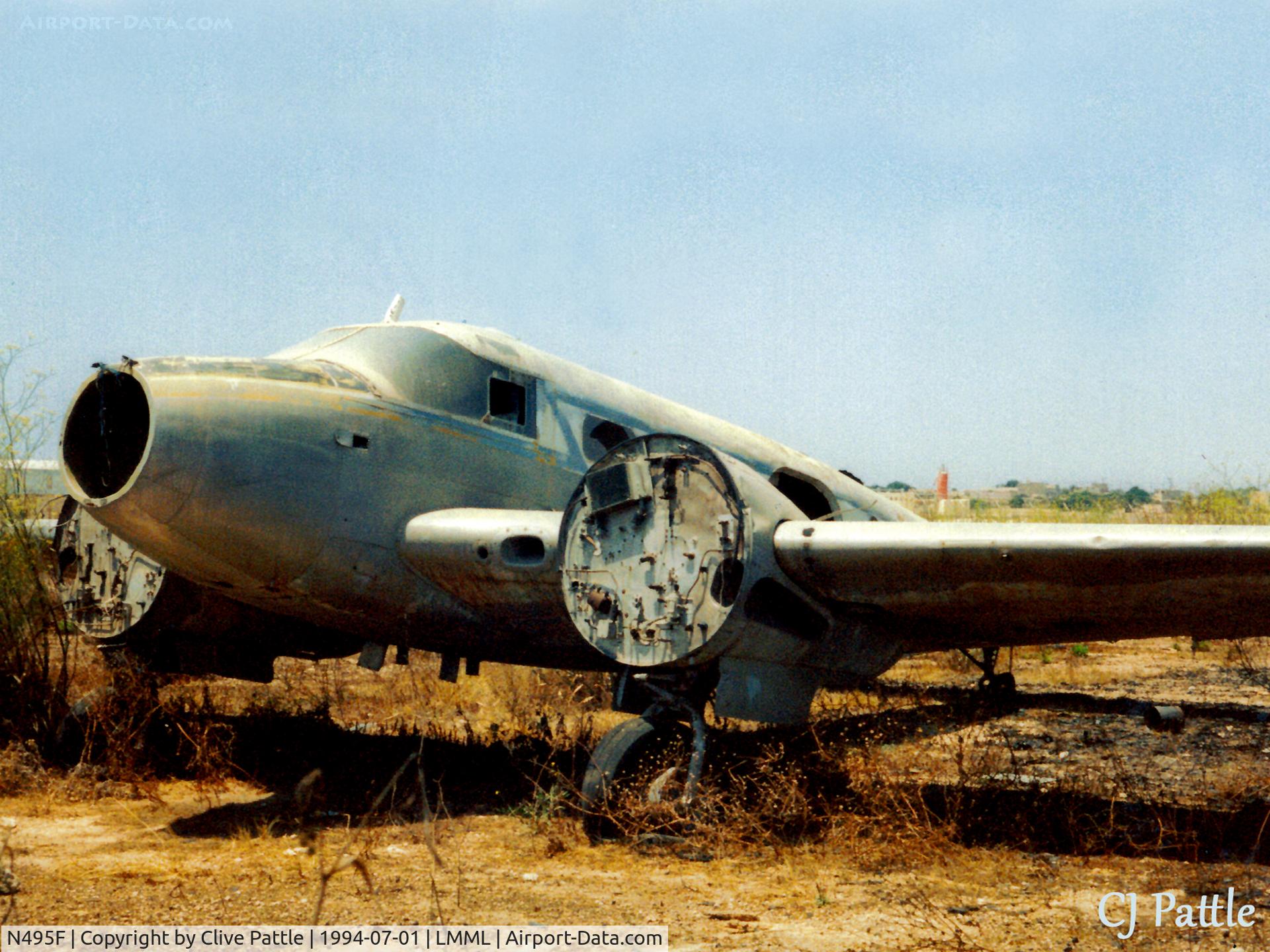 N495F, Beech D18S C/N AF-888, Scanned from print. Remains of Beech 18/C-54H N495F at the International Fire Training Centre at Hal Far (disused) Malta. ICAO LMML used for ref/search purposes. A/c is ex  USAF 52-10958