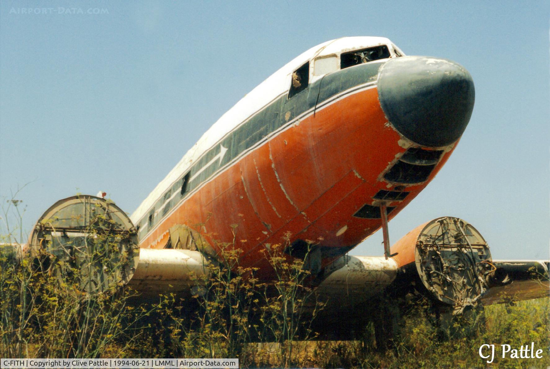 C-FITH, 1944 Douglas C-47A Skytrain C/N 20228, Scanned from print - another view of Dakota C-FITH at the International Fire Training Centre, Hal Far (disused), Malta in Jun 1994. LMML used only for ref/search purposes