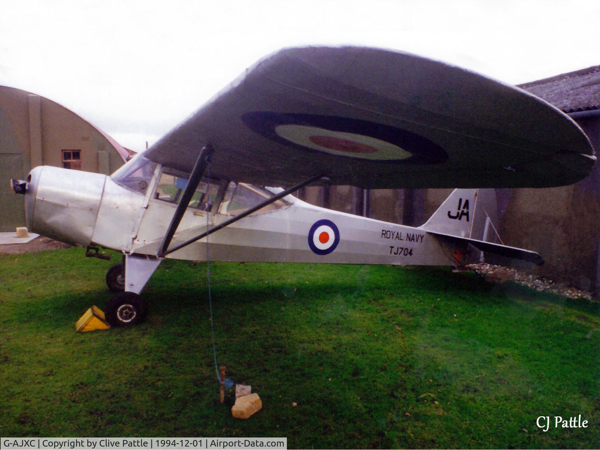 G-AJXC, 1944 Taylorcraft J Auster 5 C/N 1409, Pictured at the Yorkshire Aircraft Museum, Elvington in December 1994 in RN markings 'TJ704' coded JA