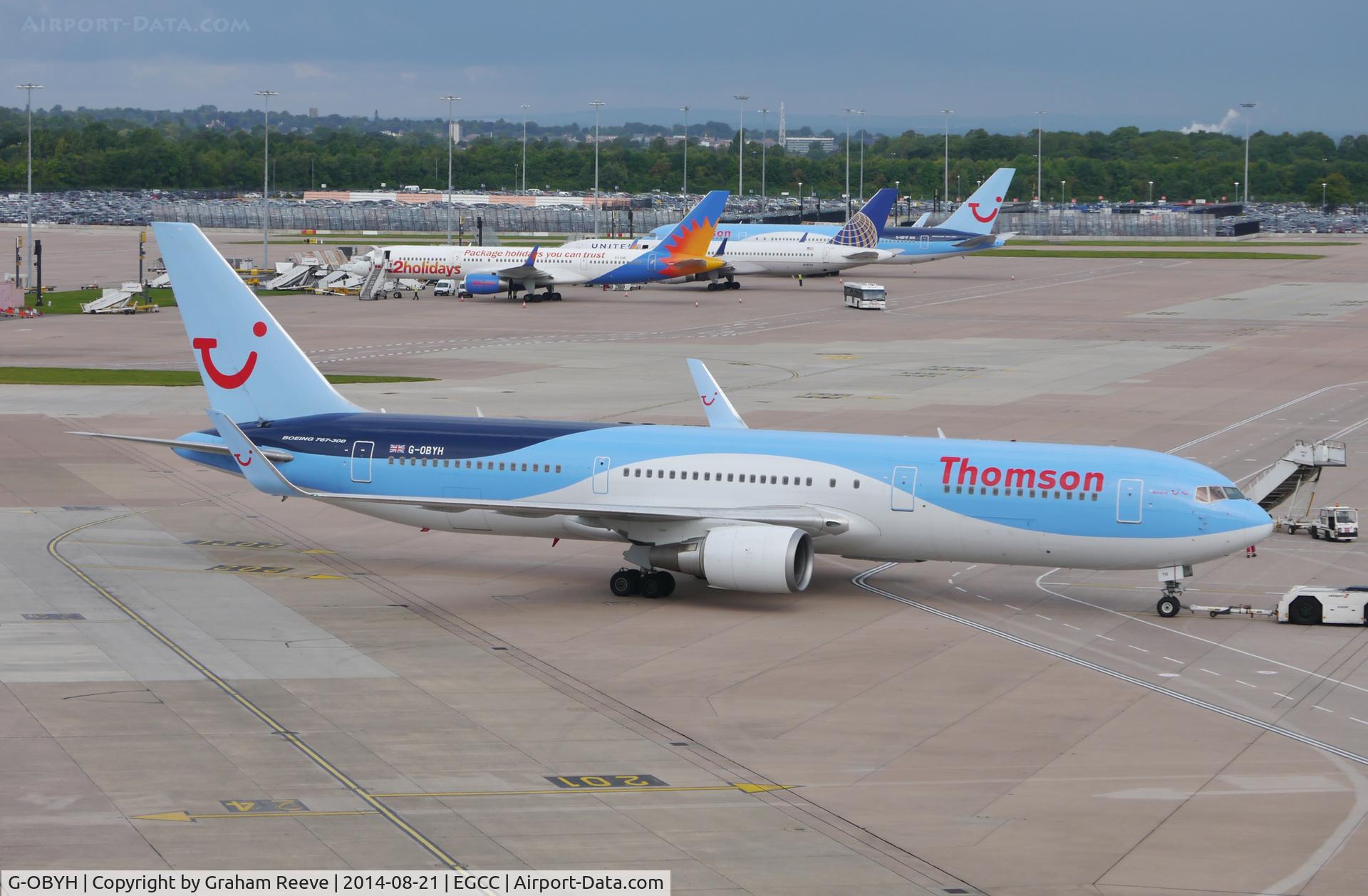 G-OBYH, 1999 Boeing 767-304/ER C/N 28883, Under tow at Manchester.