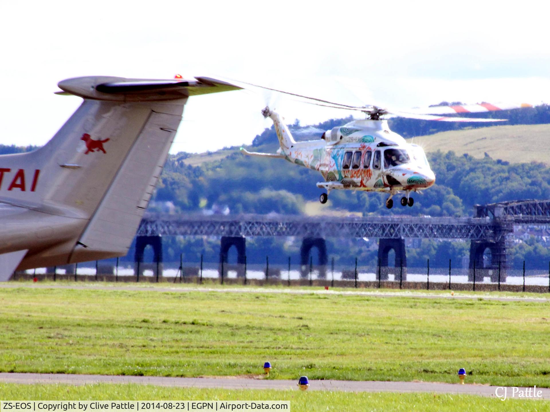 ZS-EOS, 2013 AgustaWestland AB.139 C/N 31502, ZS-EOS lifts off from Dundee Riverside Airport EGPN just as visiting PC-12 LX-TAI taxies in. What a day.