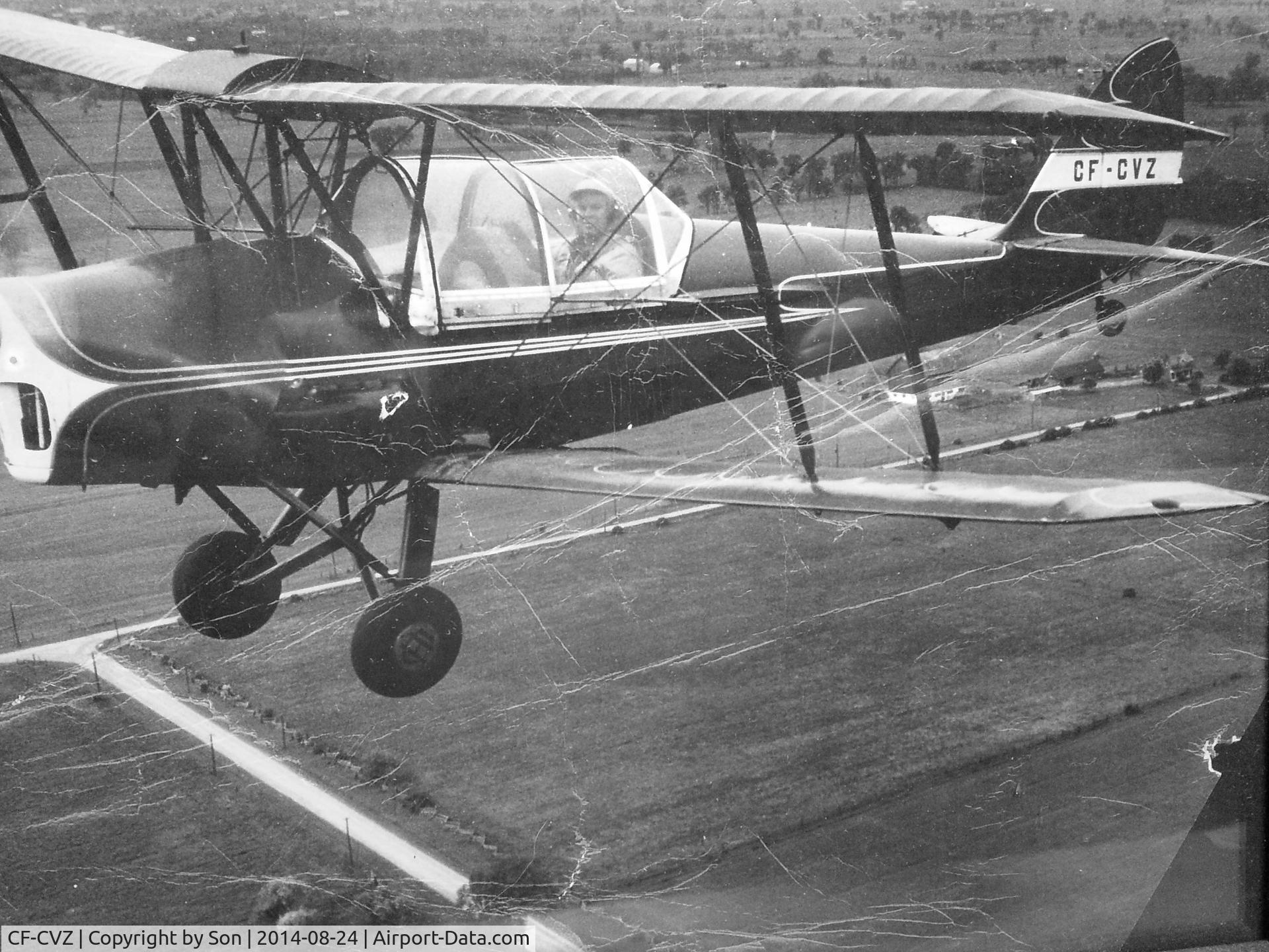 CF-CVZ, 1950 De Havilland Canada DH-82C Tiger Moth C/N DHC1481, Fraser in flight over Levens Bros. Toronto. 
Airport was located just N of the West corner , Duffrin St.  and Eglington Ave.  
We loved this little cruiser