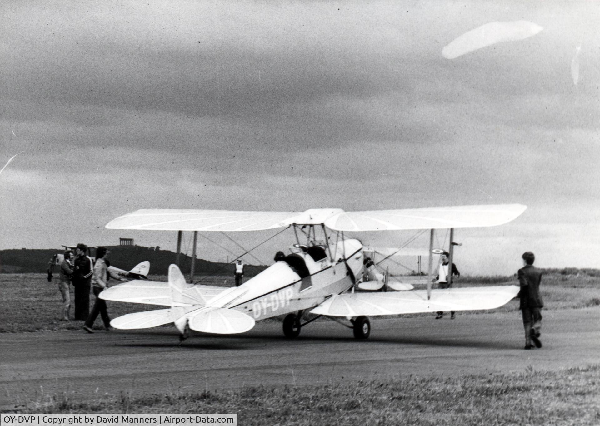 OY-DVP, 1943 De Havilland DH-82A Tiger Moth II C/N 85506, This photo was taken at a rally for Gypsy and Tiger Moth biplanes in 1979 at a refuelling stop at Sunderland airport in England. This airport no longer exists but is the site of a large Nissan car plant and the North East Aircraft Museum..