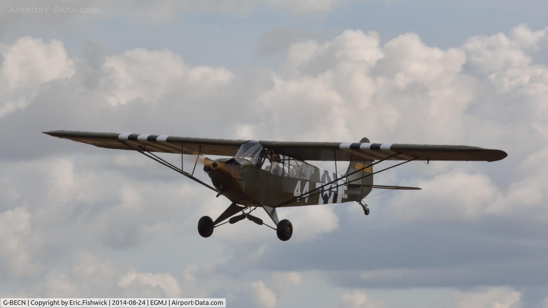 G-BECN, 1944 Piper L-4J Grasshopper (J3C-65D) C/N 12776, 43. 44-80480 ('Miss Norah') arriving at a superb Little Gransden Air & Car Show, Aug. 2014.