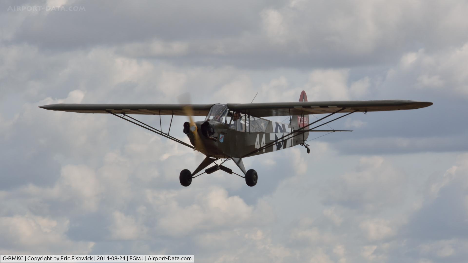 G-BMKC, 1943 Piper L-4H Grasshopper (J3C-65D) C/N 11145, 43. G-BMKC arriving at a superb Little Gransden Air & Car Show, Aug. 2014.