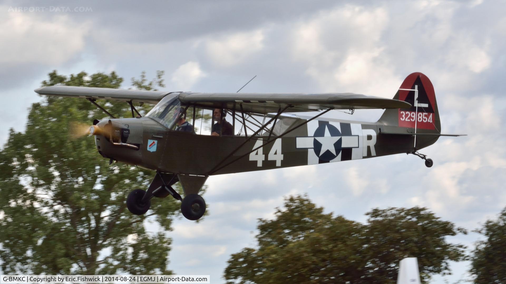 G-BMKC, 1943 Piper L-4H Grasshopper (J3C-65D) C/N 11145, 41. G-BMKC (329854) arriving at a superb Little Gransden Air & Car Show, Aug. 2014.