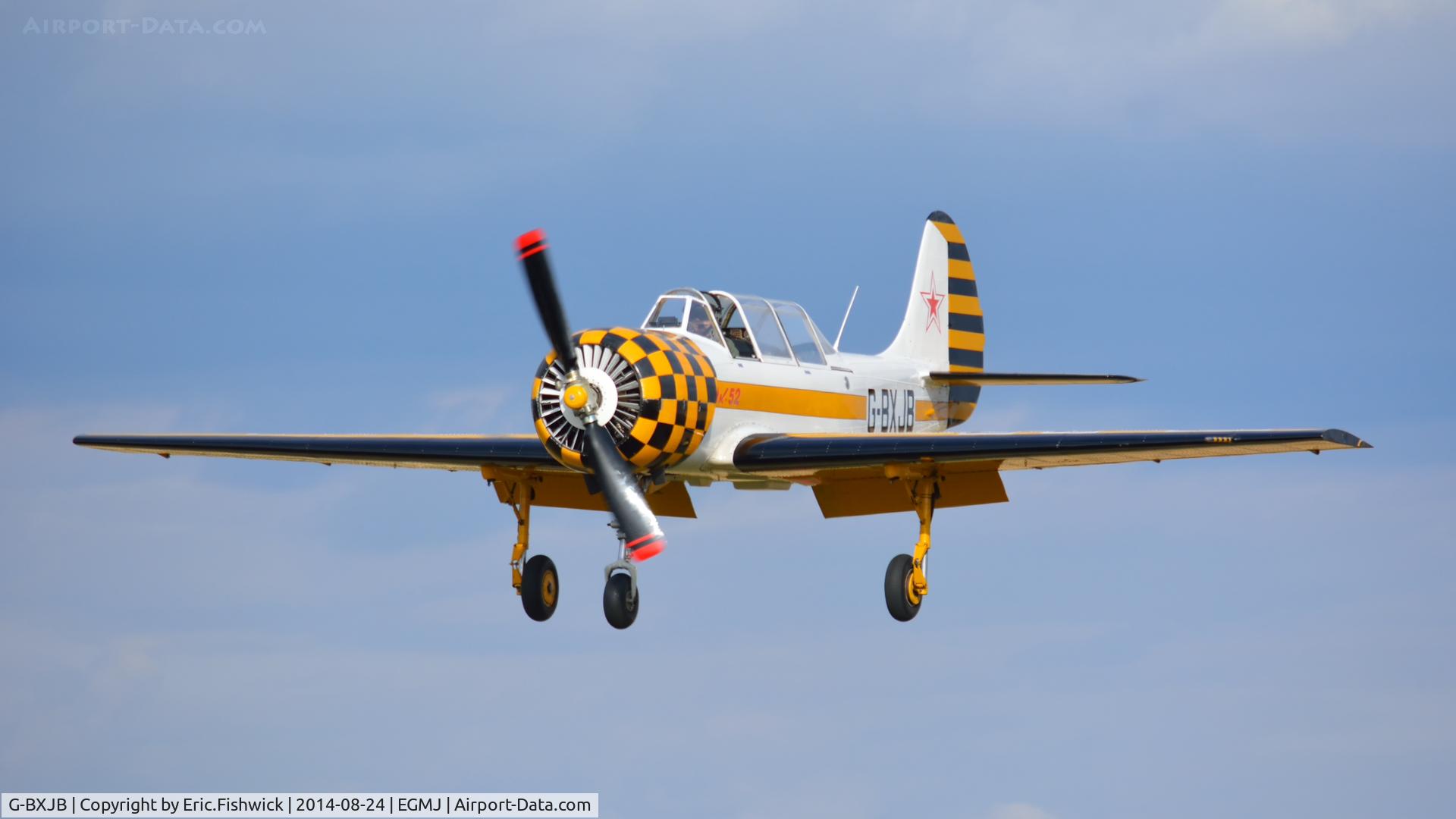 G-BXJB, 1987 Bacau Yak-52 C/N 877403, 43. G-BXJB arriving at a superb Little Gransden Air & Car Show, Aug. 2014.