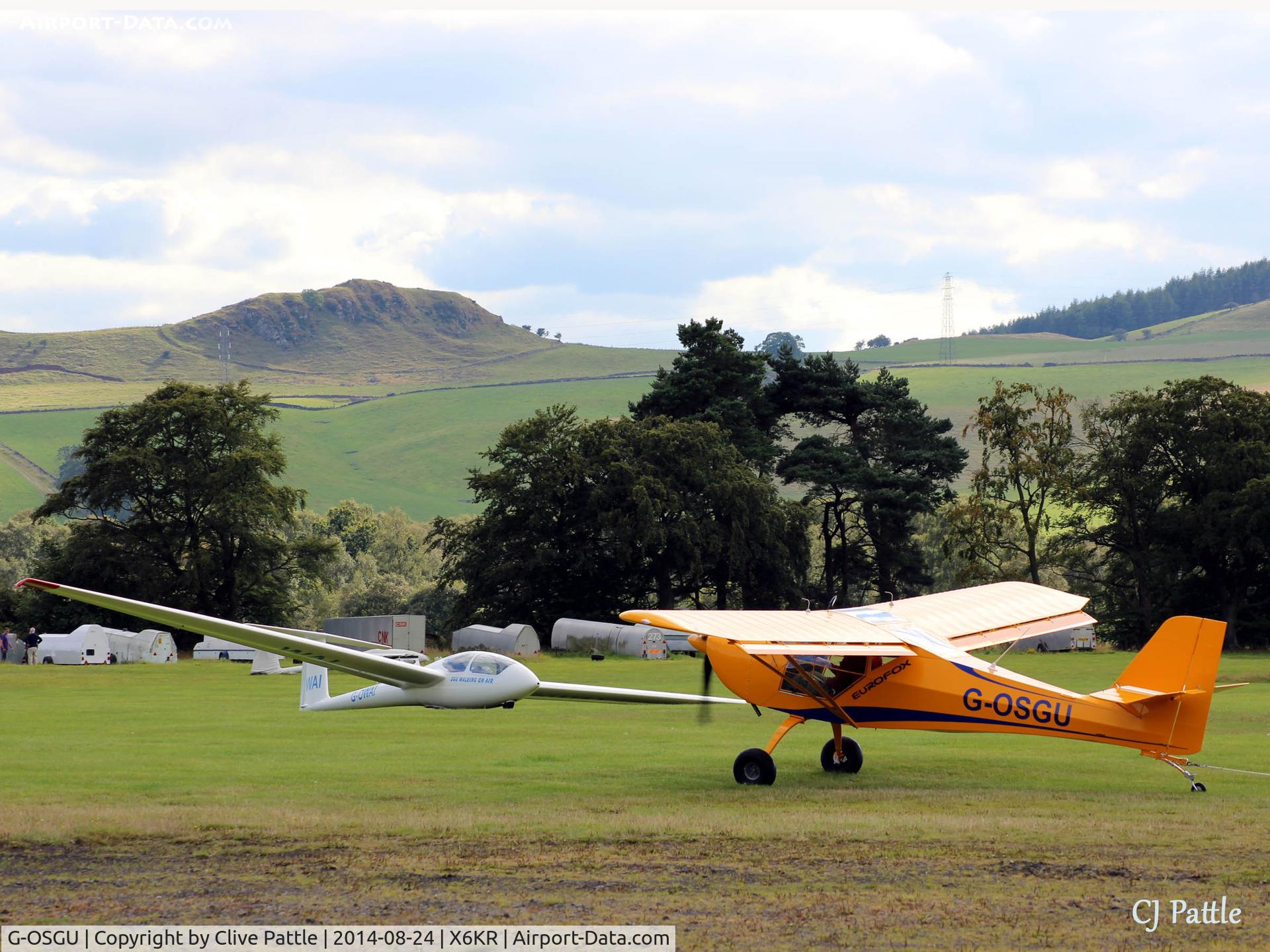 G-OSGU, 2014 Aeropro Eurofox 912(S) C/N LAA 376-15214, Busy scene at Portmoak Gliding Field, Kinross, Scotland, 'GU taxies towards its hangar still trailing its glider tow line.