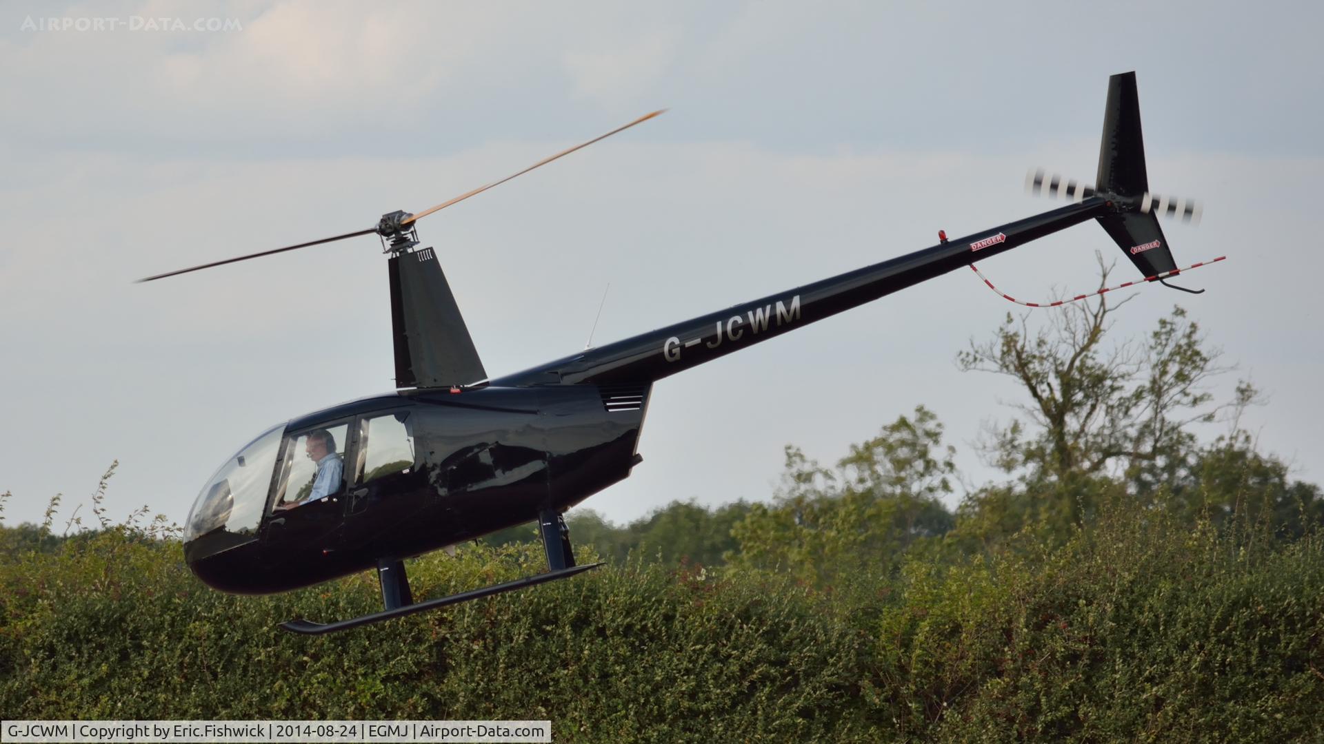 G-JCWM, Robinson R44 II C/N 11860, 41. G-JCWM departing the superb Little Gransden Air & Car Show, Aug. 2014.