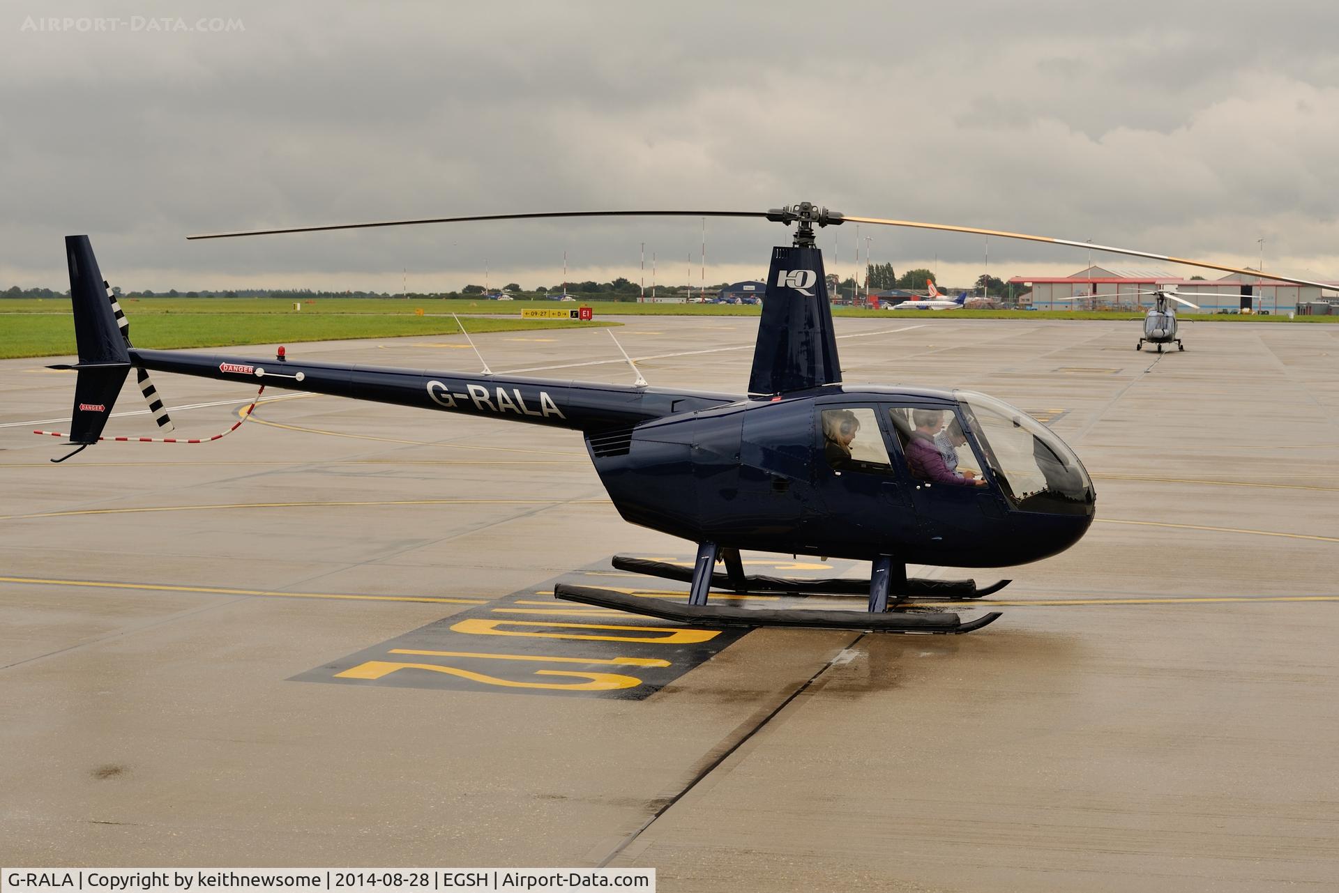 G-RALA, 2005 Robinson R44 II C/N 10788, Sitting on a wet apron !