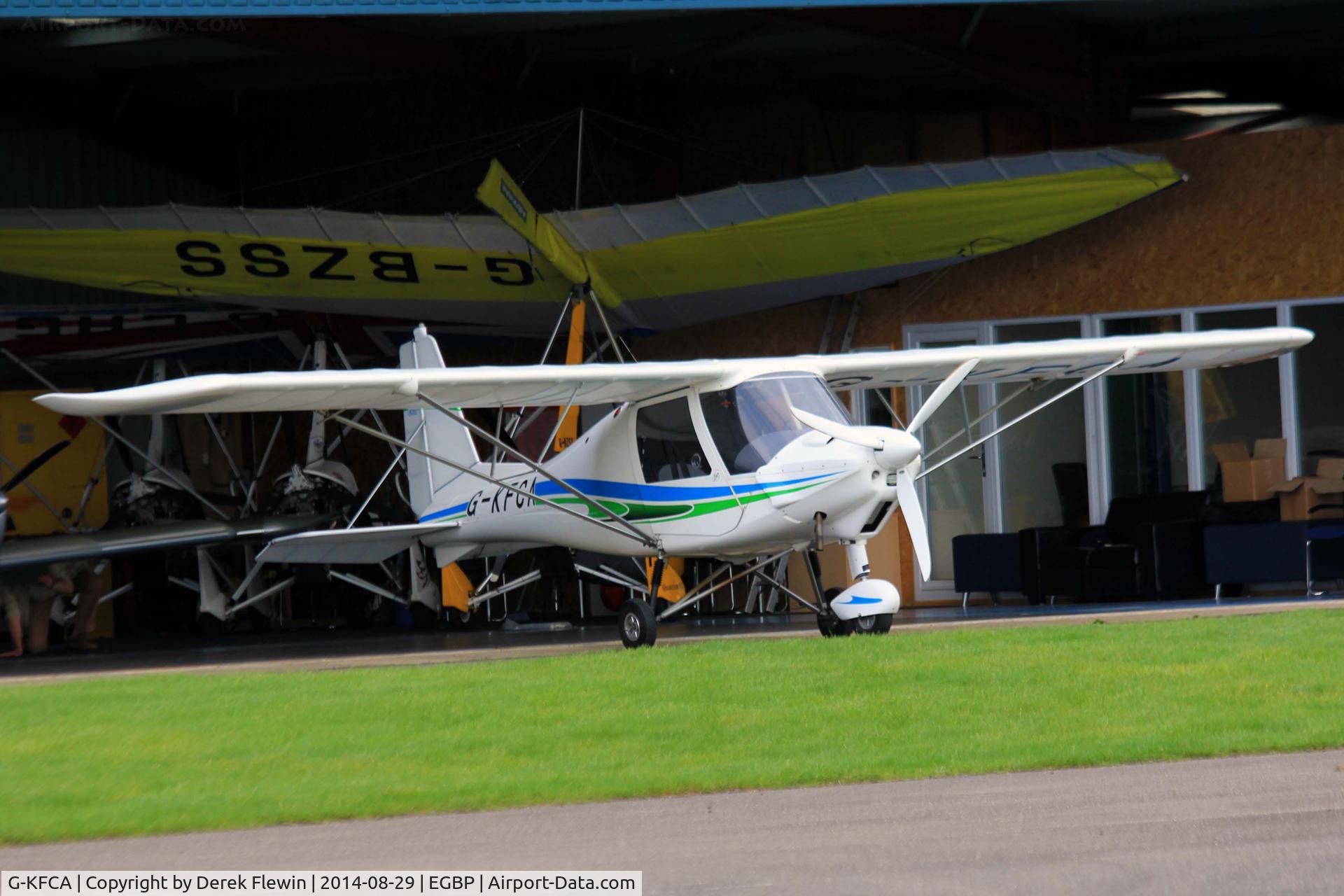 G-KFCA, 2013 Comco Ikarus C42 FB80 C/N 1309-7282, Kemble based, Ikarus, seen outside its' hangar at EGBP.
