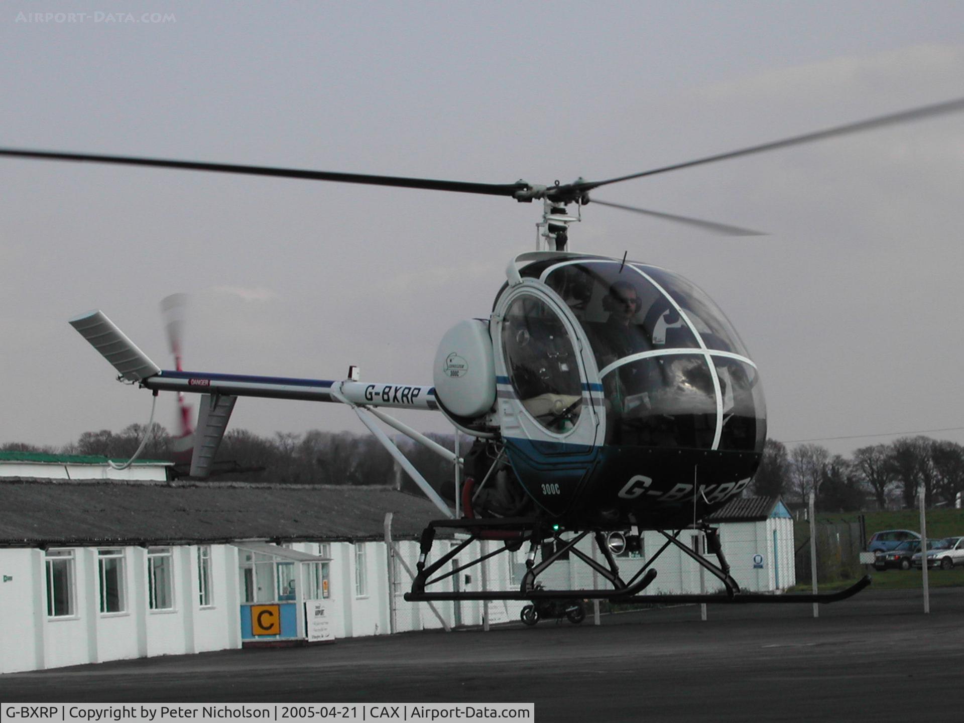 G-BXRP, 1988 Schweizer 269C C/N S-1334, This Schweizer 269C of AH Helicopter Services was seen at Carlisle in April 2005.