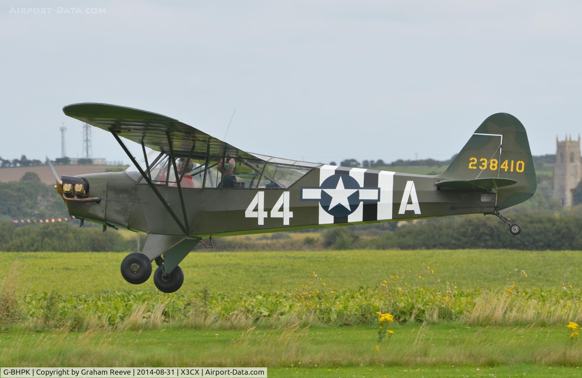 G-BHPK, 1943 Piper L-4H Grasshopper (J3C-65D) C/N 12161, About to touch down at Northrepps.